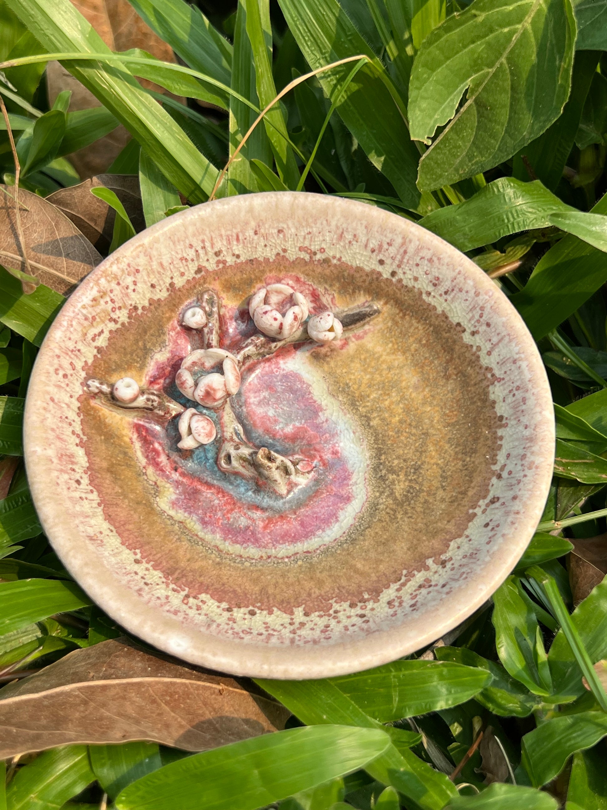 This is a woodfired pottery flower teacup