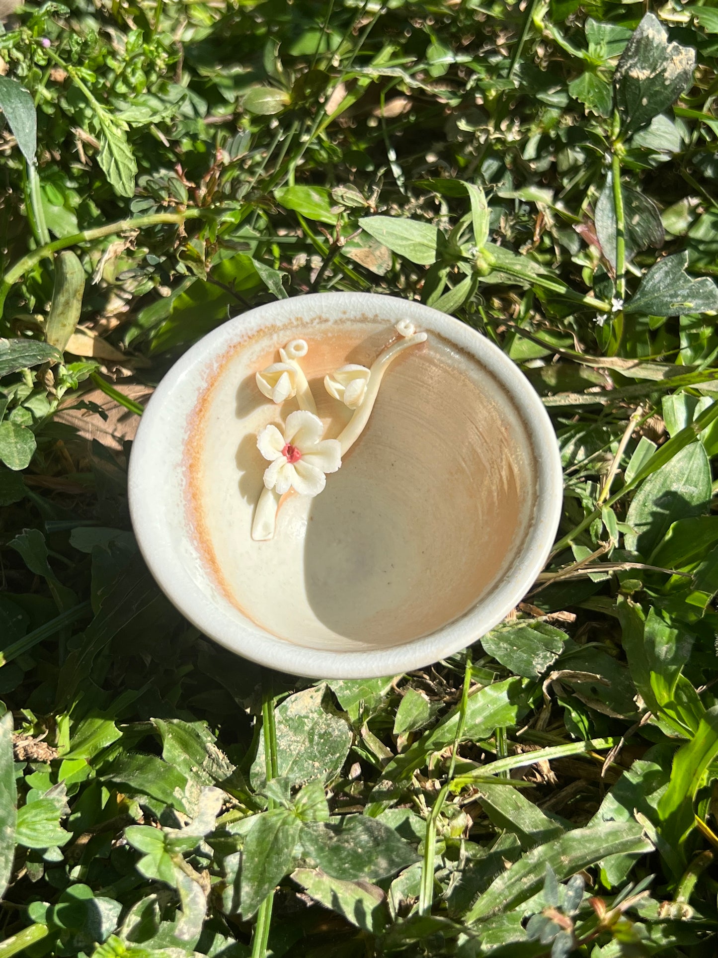 This is a woodfired pottery flower teacup