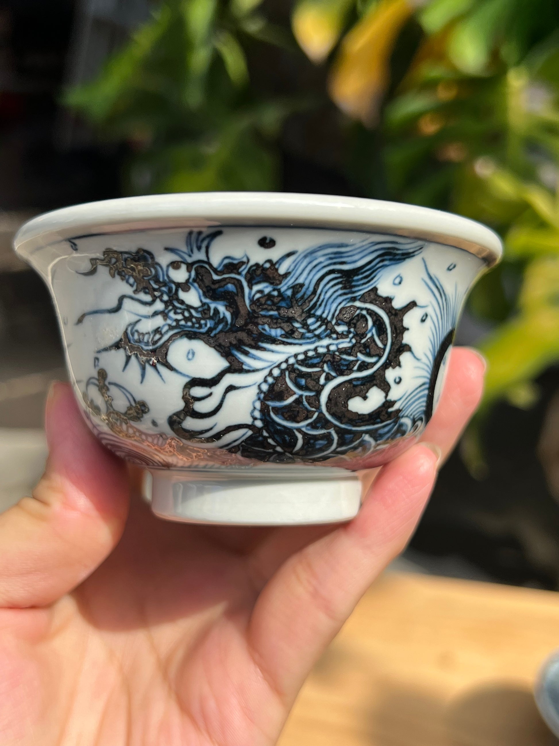 This is a Chinese Jingdezhen blue and white porcelain dragon teapot gaiwan