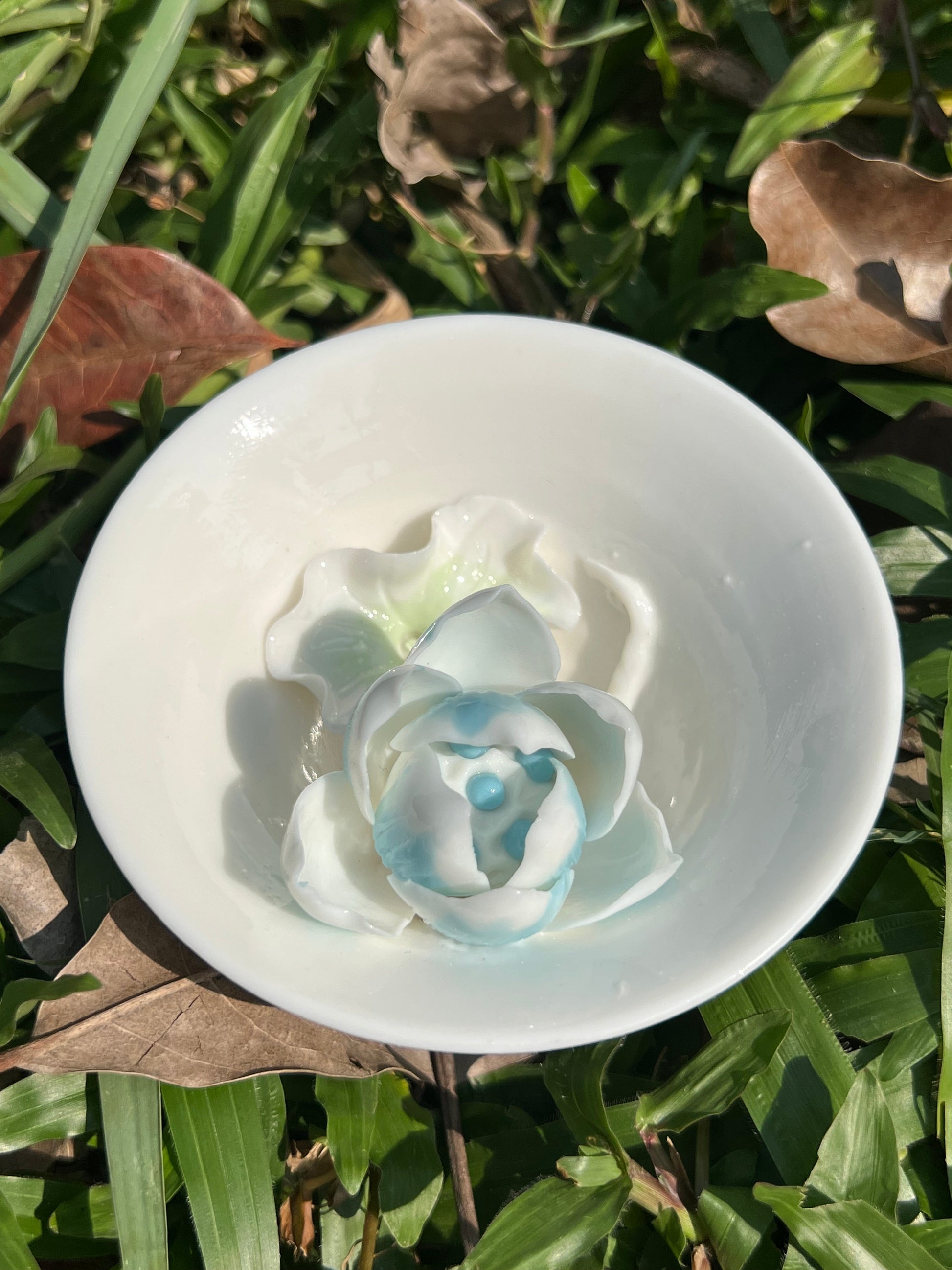 this is a woodfired white fine pottery flower teacup