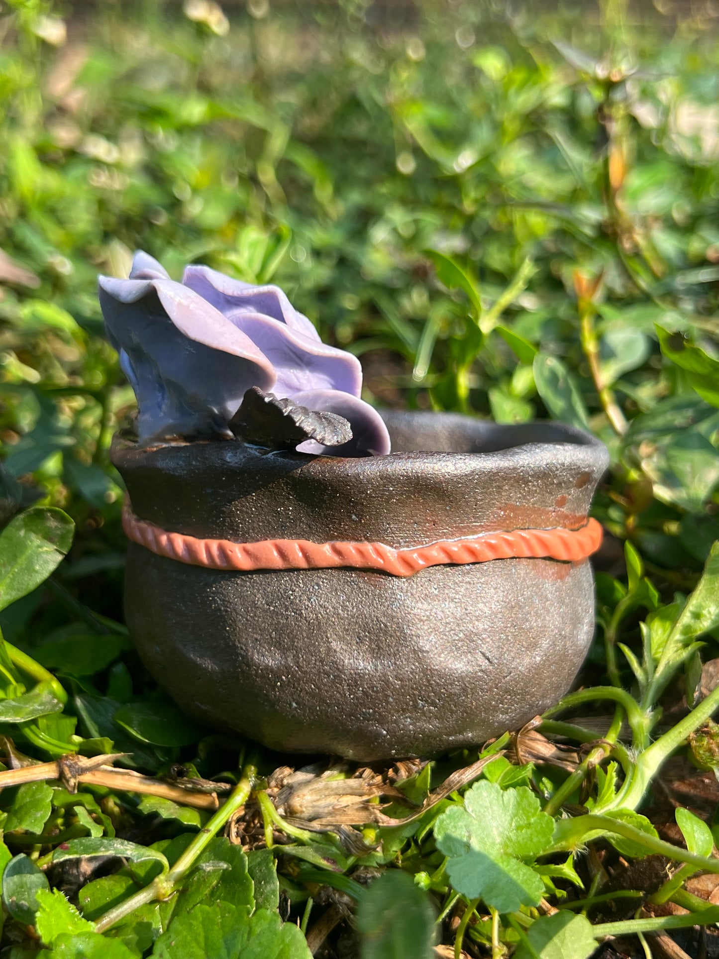 This is a woodfired tietai pottery flower teacup