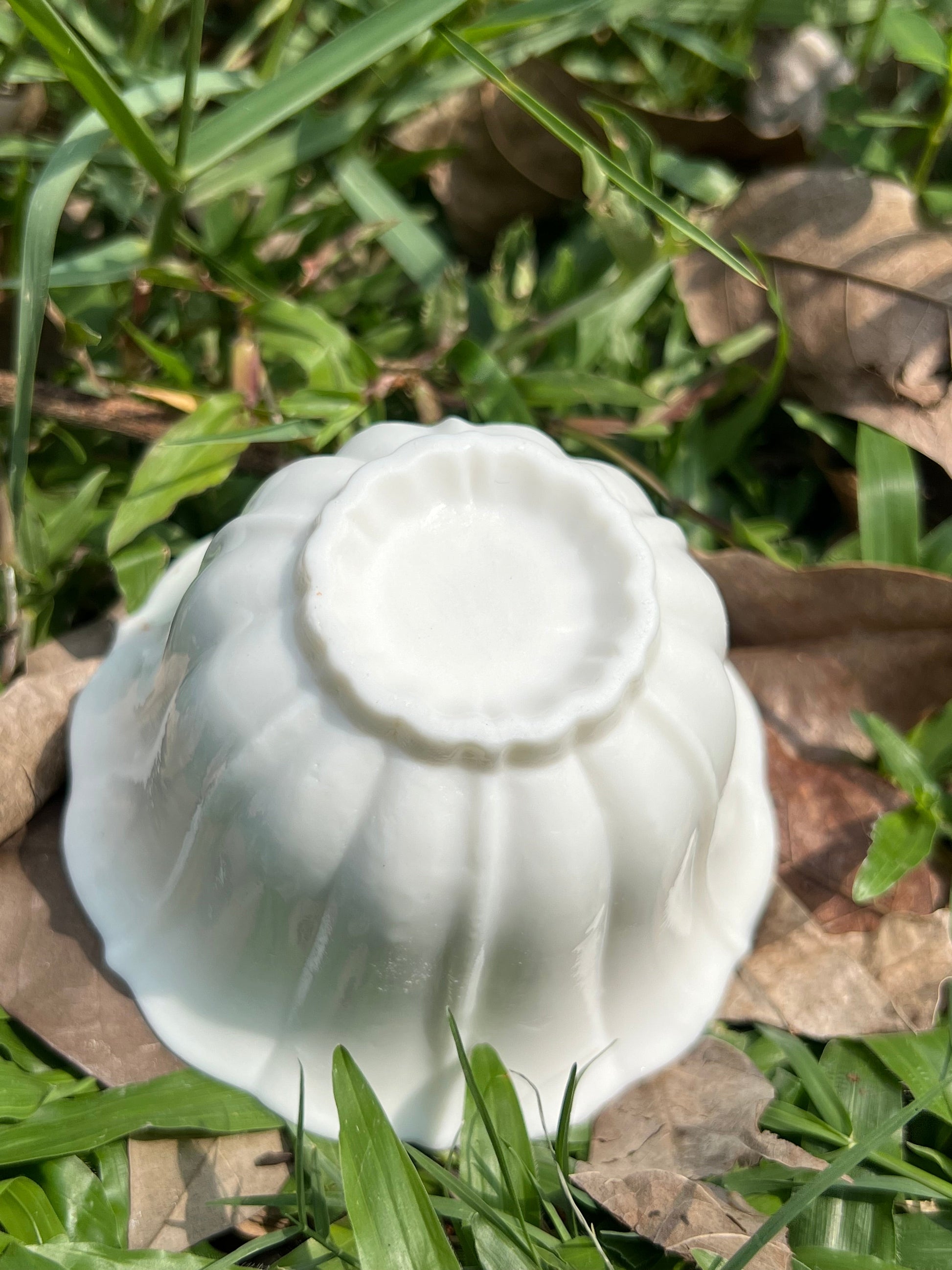 this is a woodfired white fine pottery flower teacup