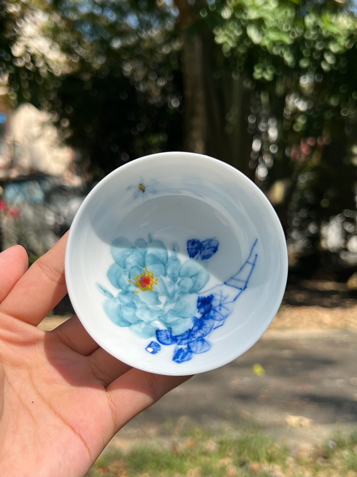 This is a Chinese Jingdezhen blue and white porcelain peony flower teacup