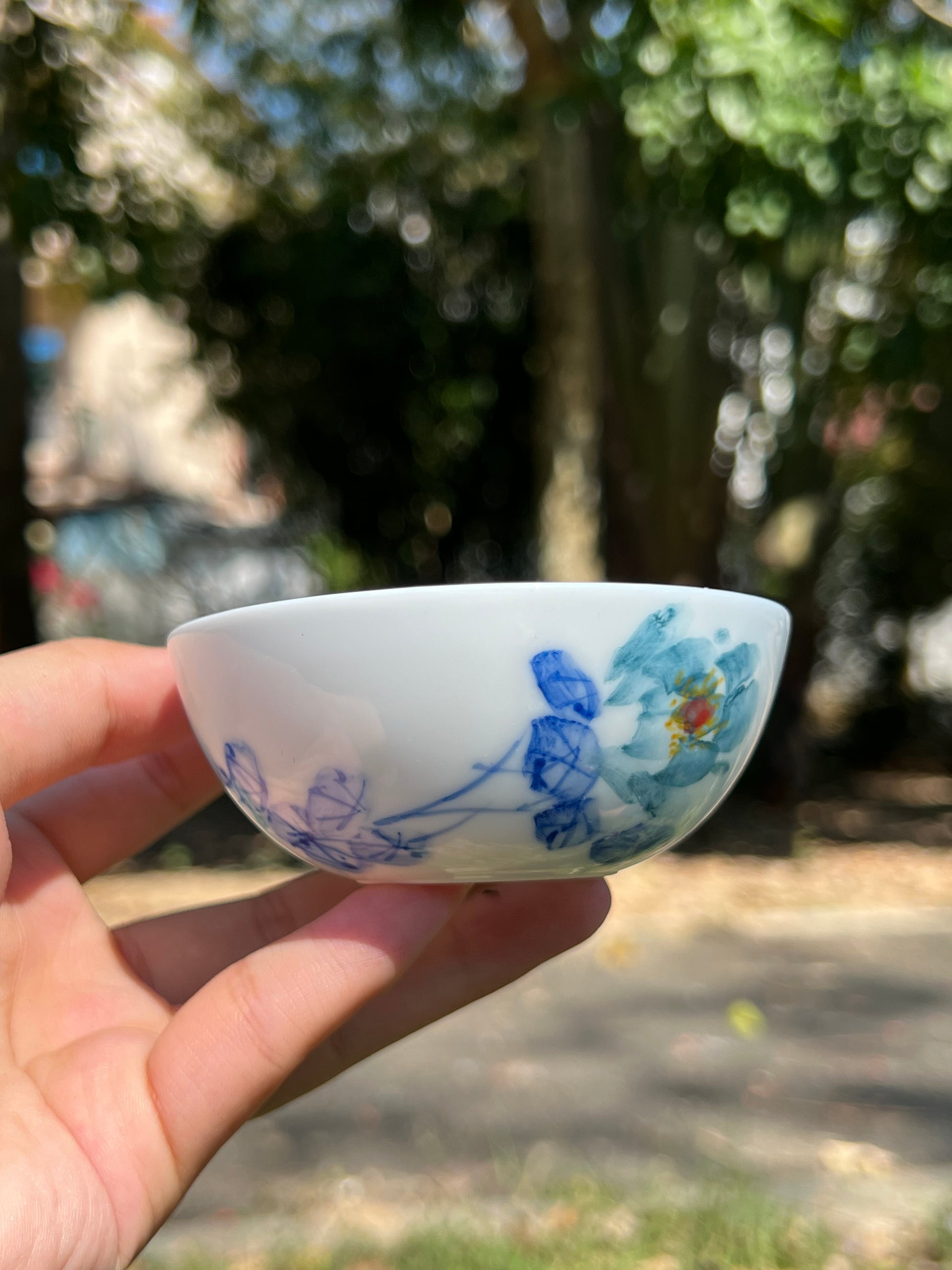 This is a Chinese Jingdezhen blue and white porcelain peony flower teacup