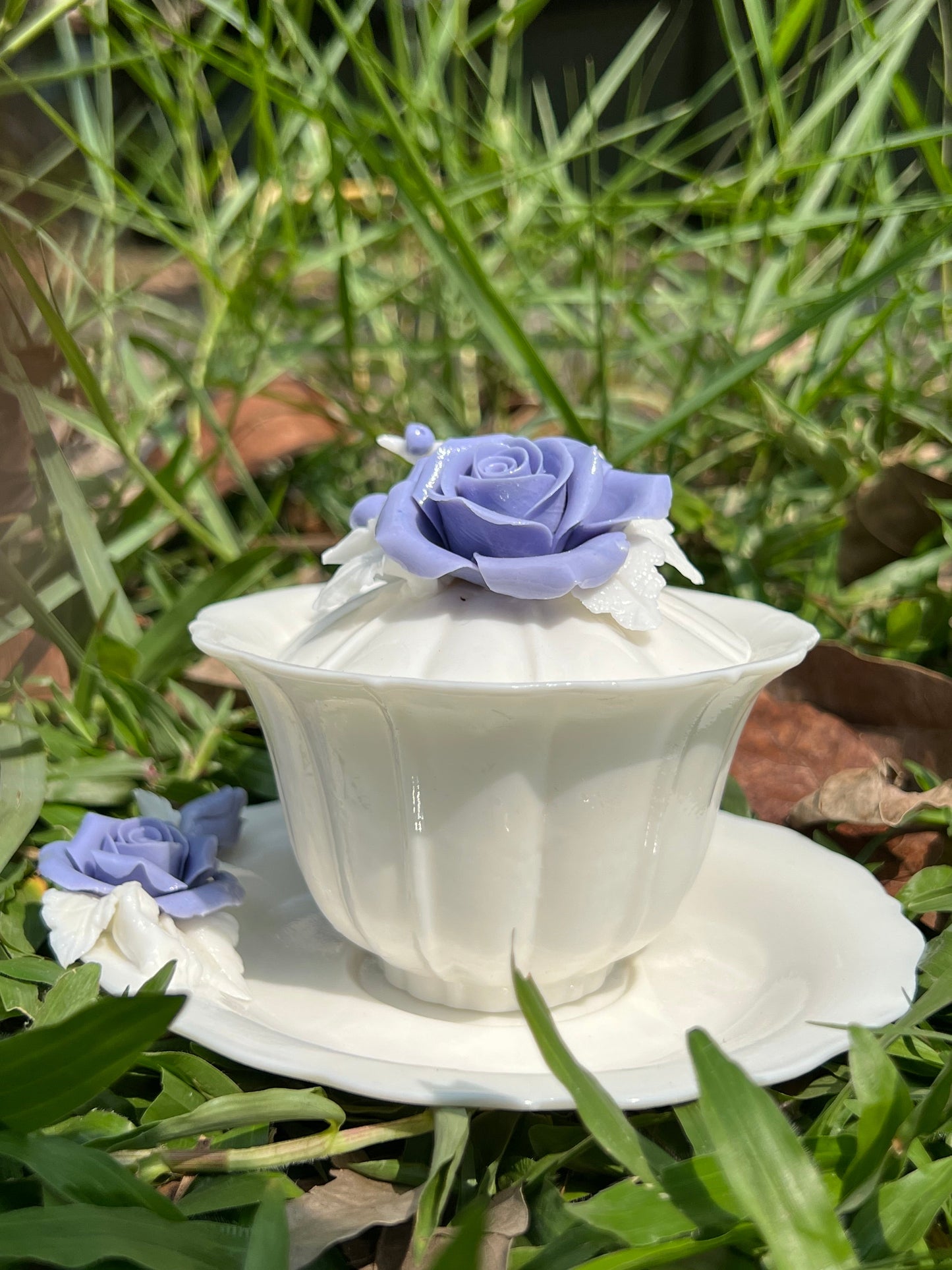 this is a woodfired white fine pottery flower teacup