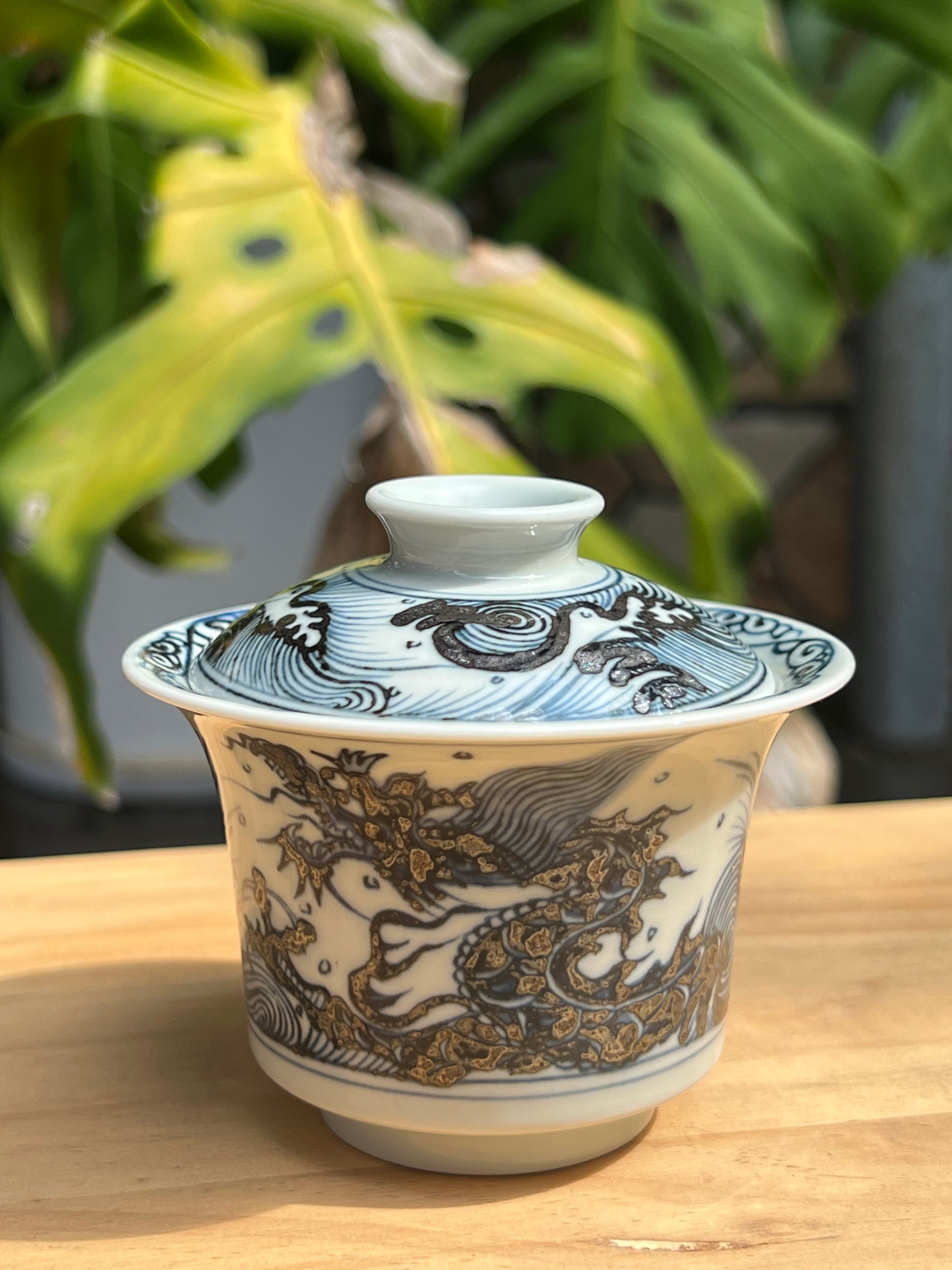 This is a Chinese Jingdezhen blue and white porcelain dragon teapot gaiwan