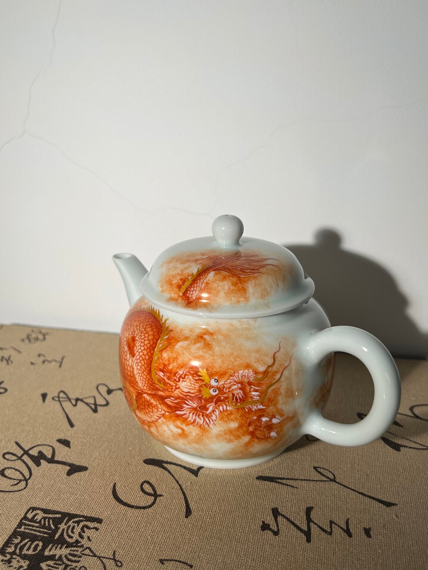 this is a Chinese Jingdezhen alum red dragon phoenix teapot.this is a ceramic teapot