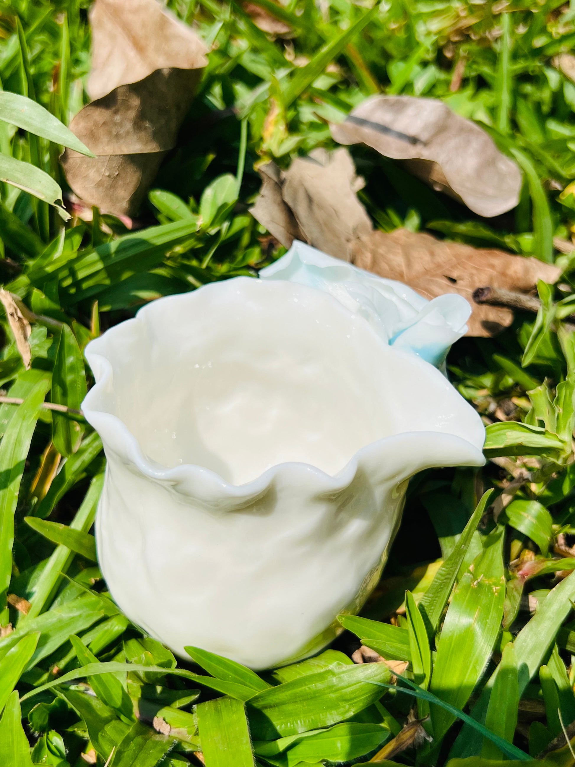 this is a woodfired white fine pottery flower teacup