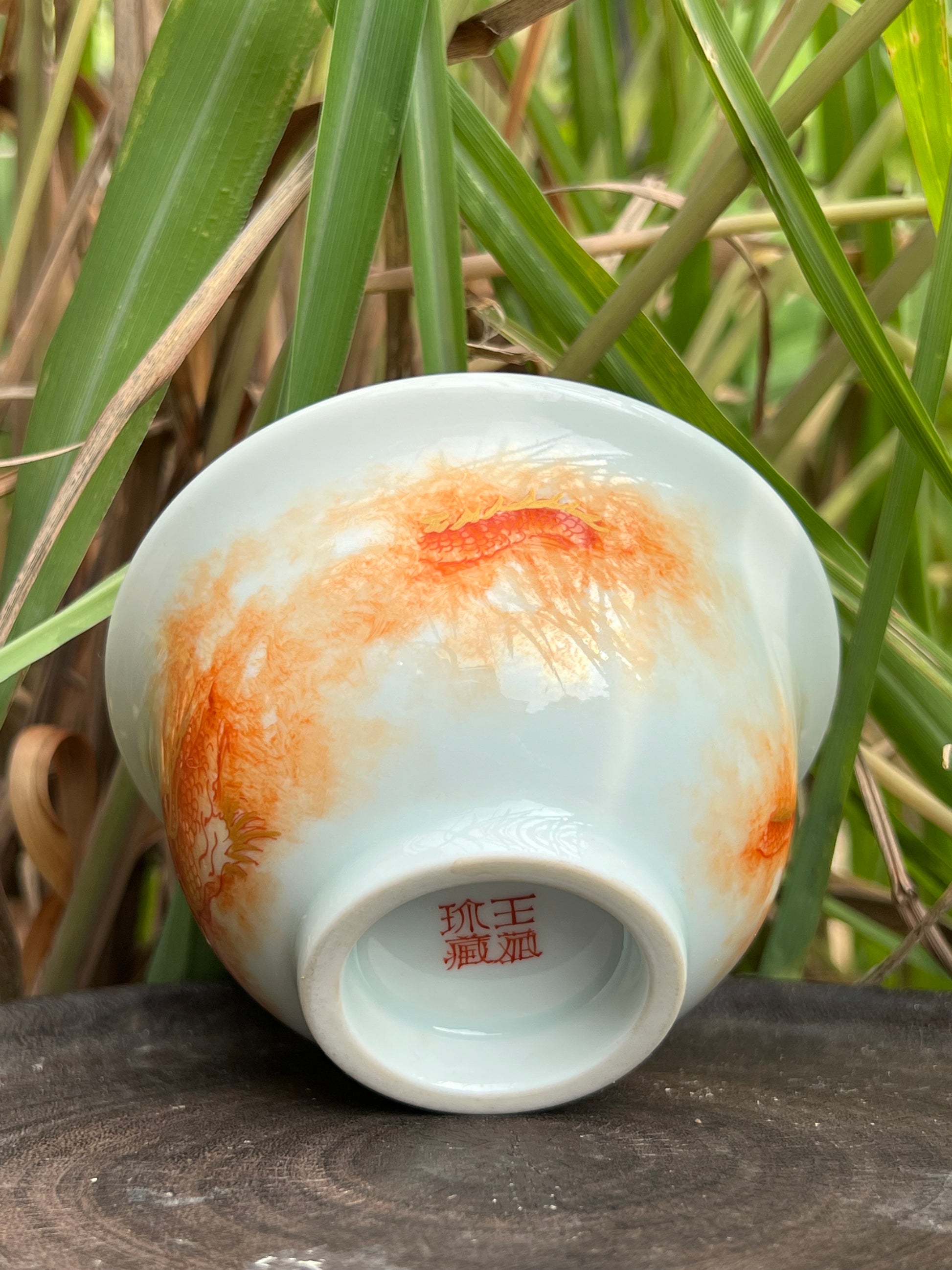 this is a Chinese Jingdezhen alum red dragon phoenix teacup. this is a ceramic teacup