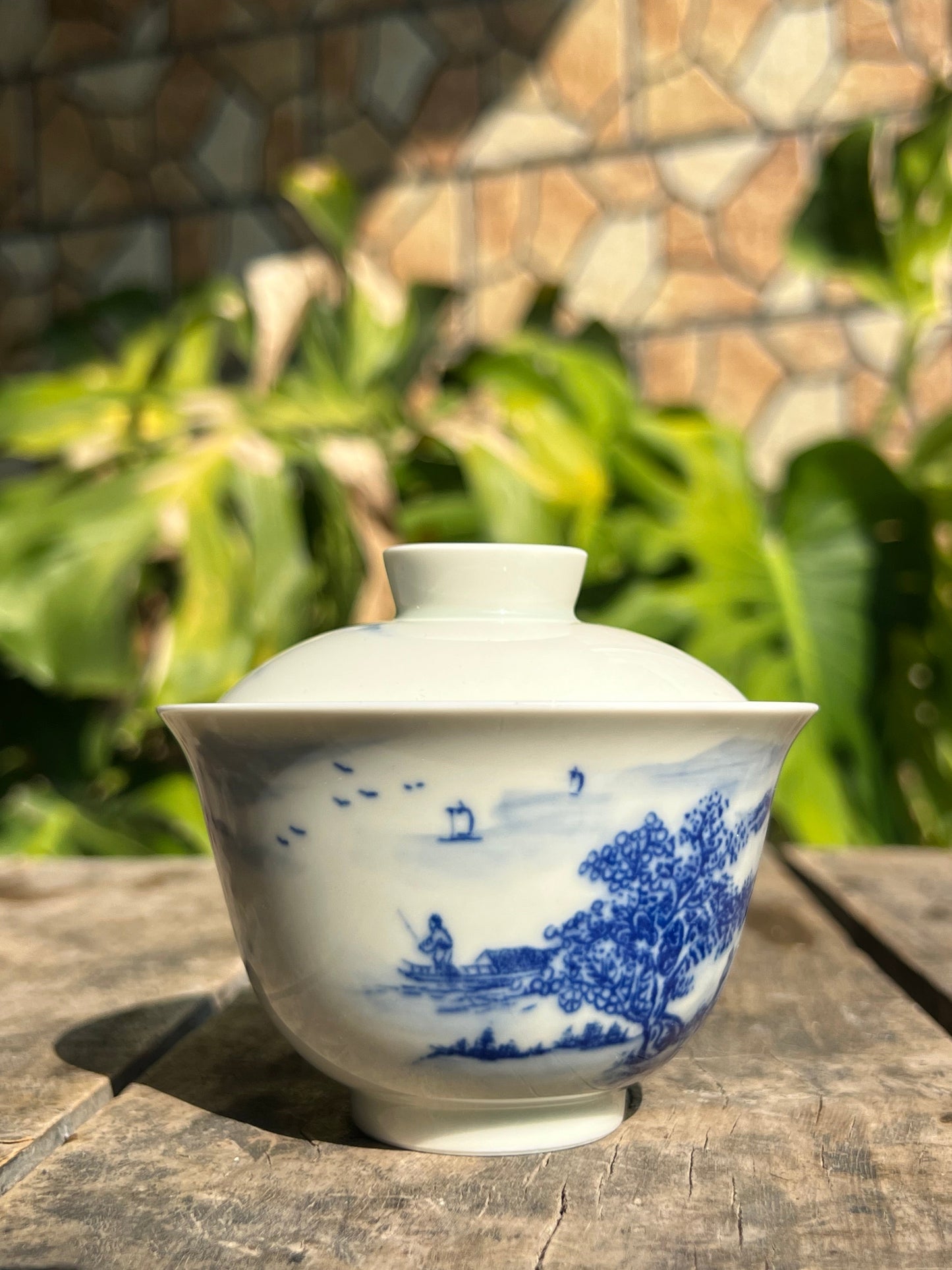 This is a Chinese Jingdezhen blue and white porcelain landscape teapot gaiwan