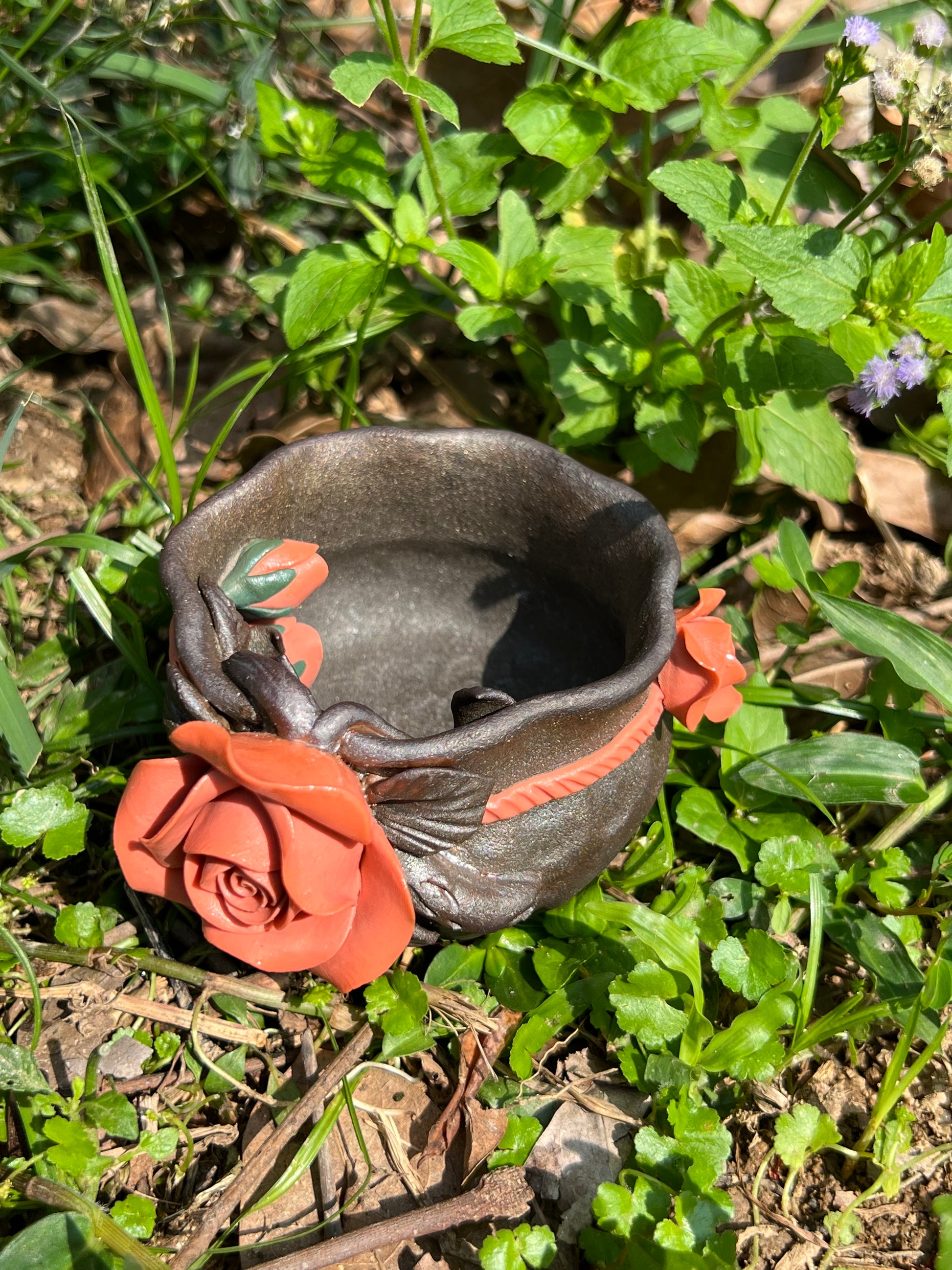 This is a woodfired tietai pottery flower teacup