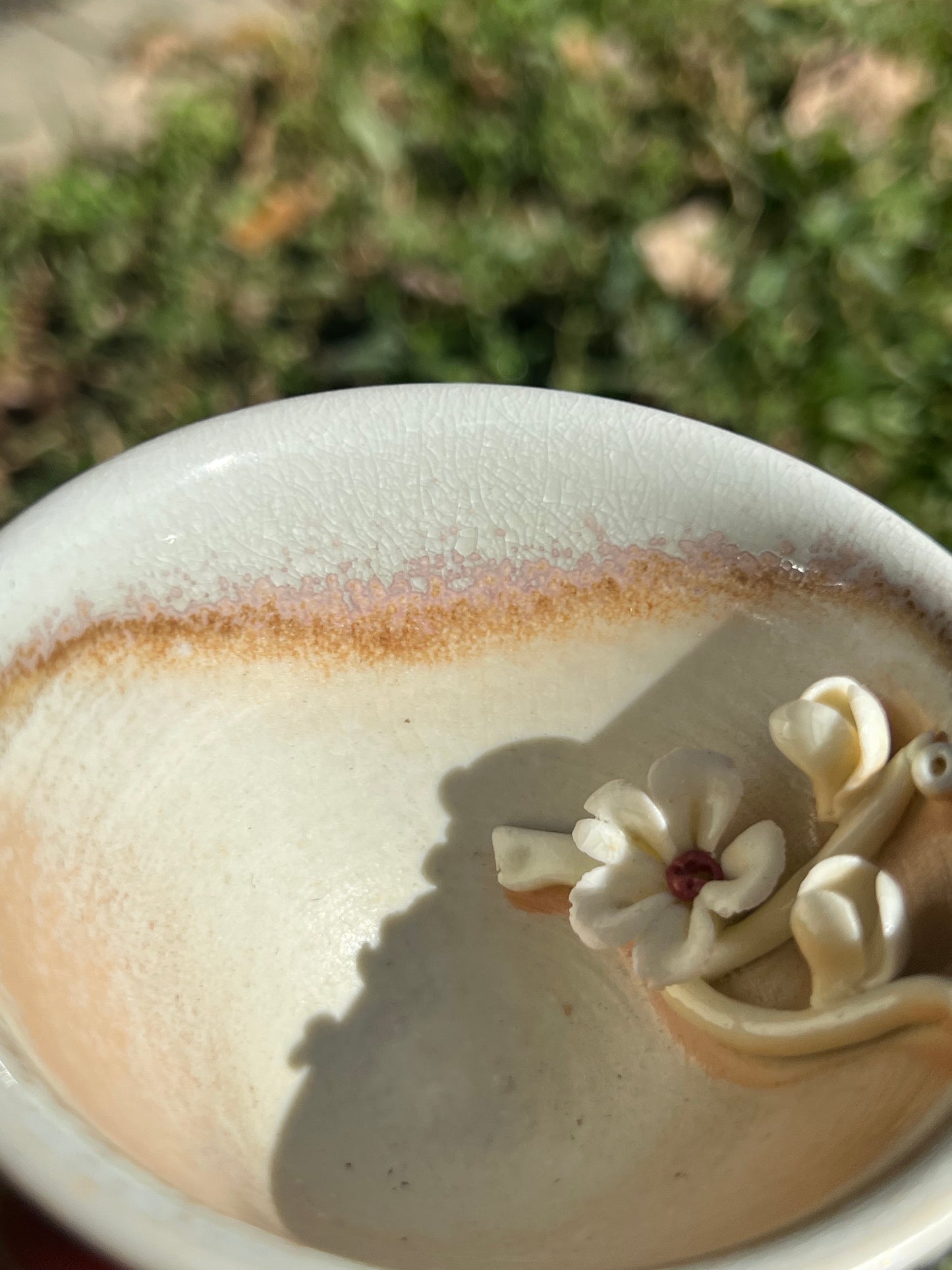 This is a woodfired pottery flower teacup