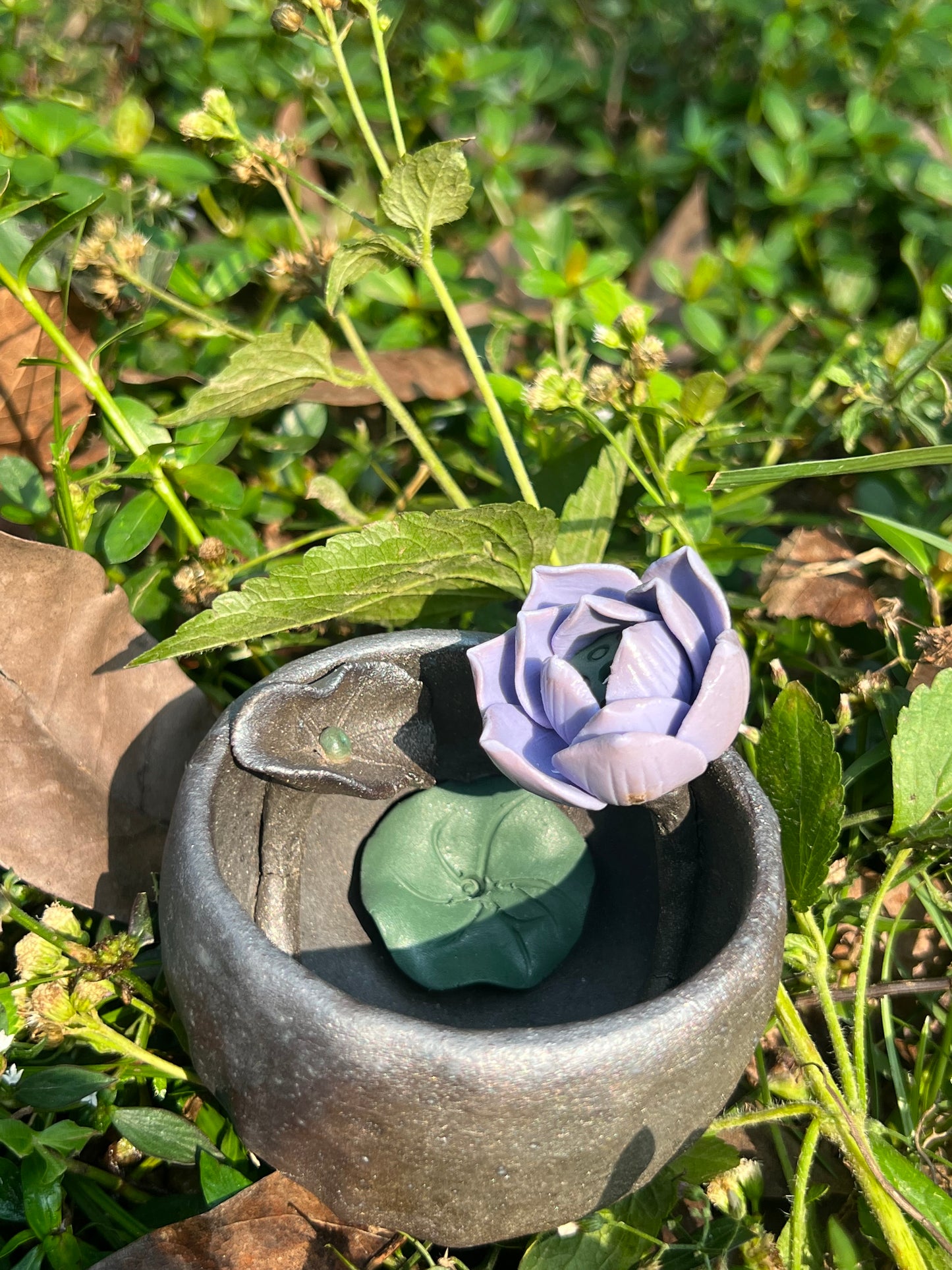 This is a woodfired tietai pottery flower teacup