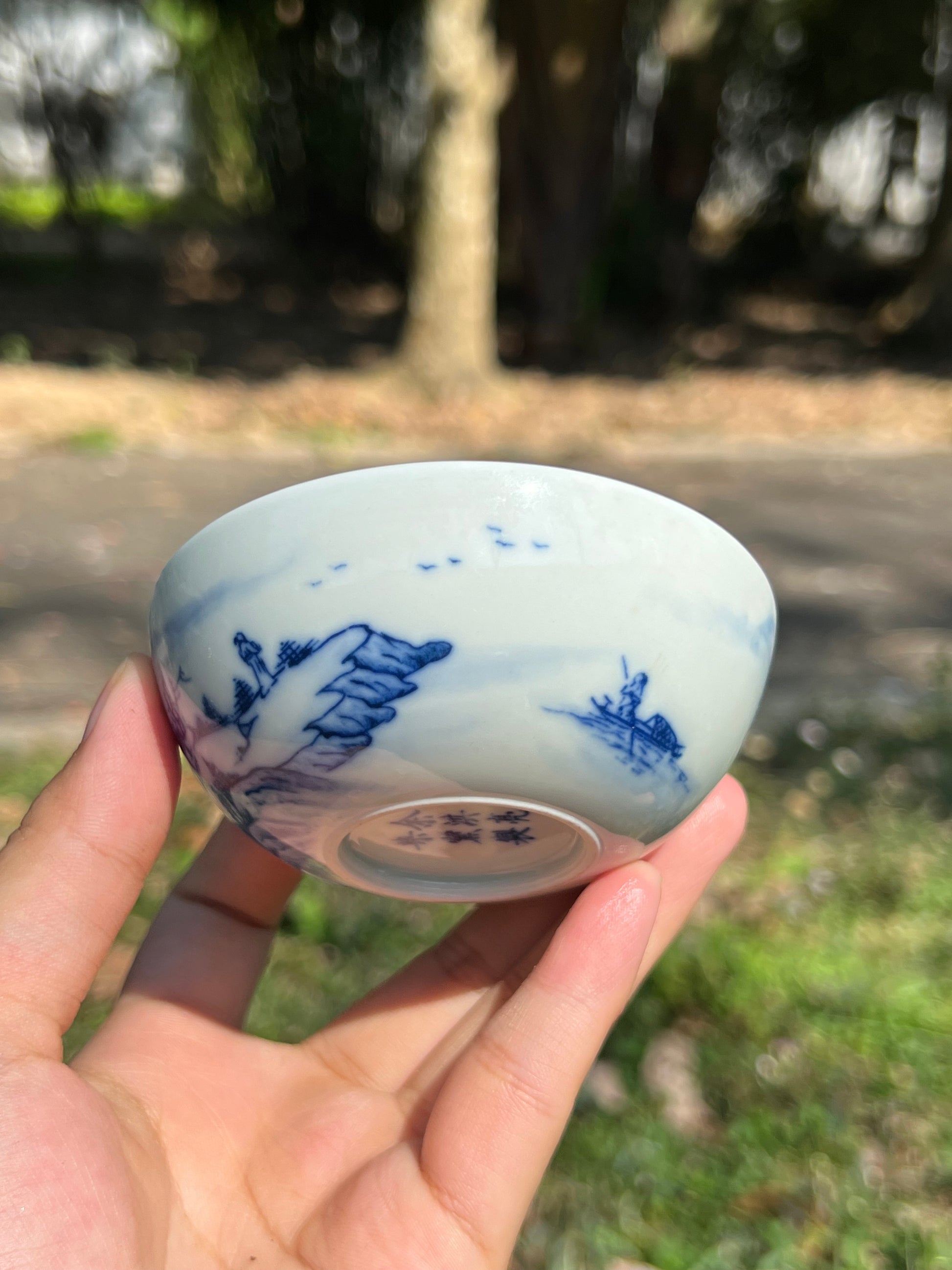 This is a Chinese Jingdezhen blue and white porcelain landscape teacup