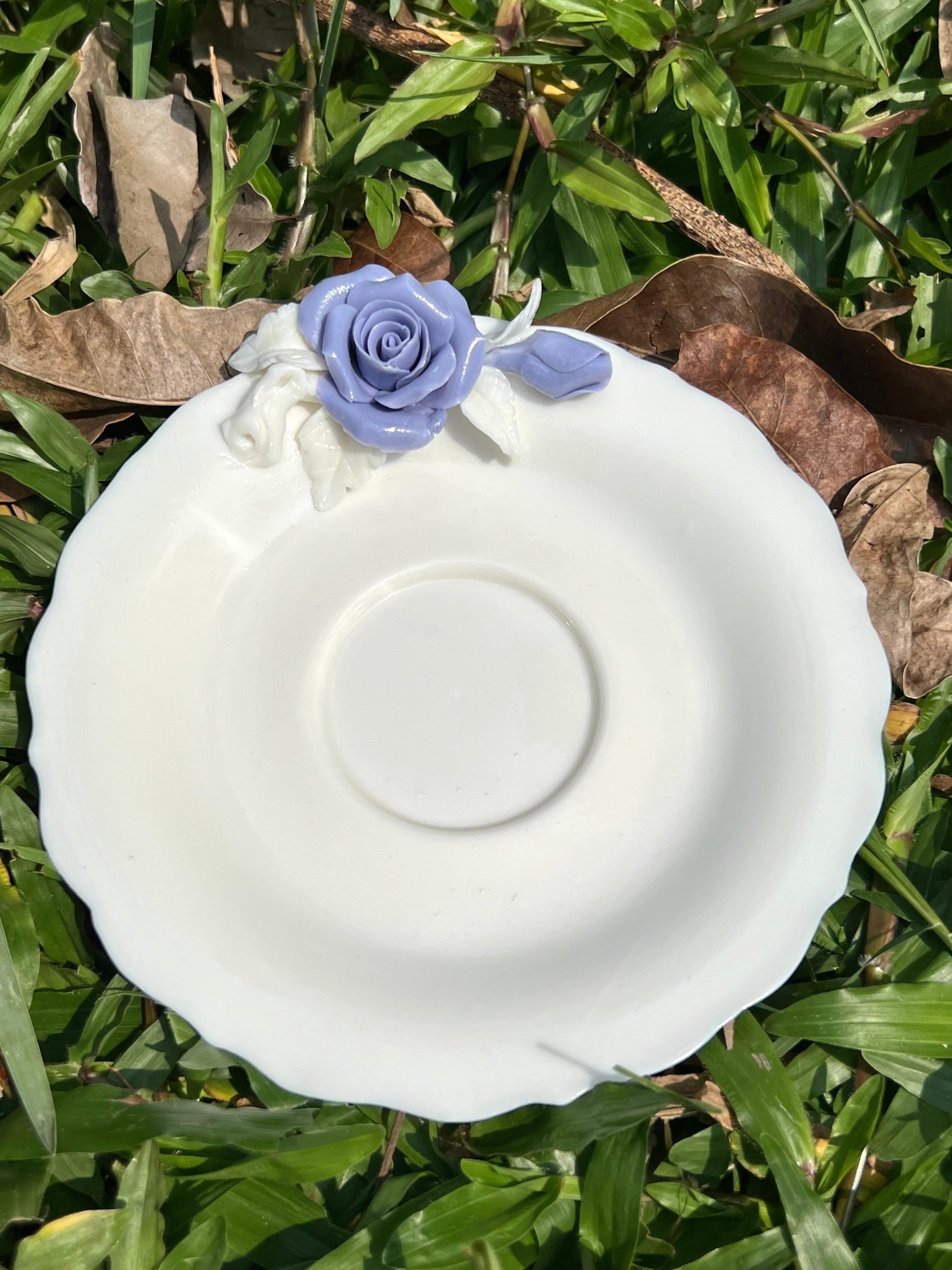 this is a woodfired white fine pottery flower teacup