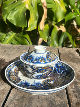 This is a Chinese Jingdezhen blue and white porcelain dragon teapot gaiwan