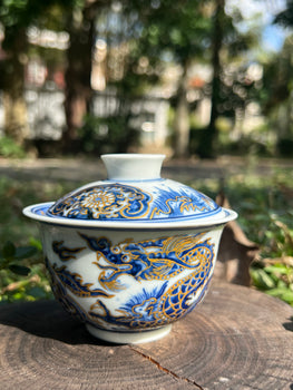 This is a Chinese Jingdezhen blue and white porcelain dragon teapot gaiwan