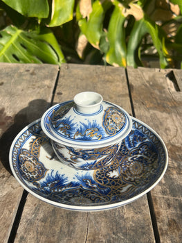 This is a Chinese Jingdezhen blue and white porcelain dragon teapot gaiwan