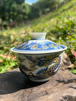 This is a Chinese Jingdezhen blue and white porcelain dragon teapot gaiwan