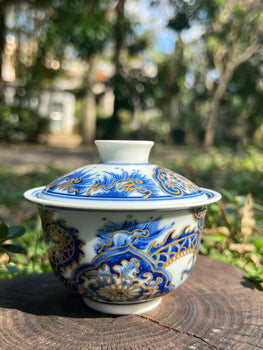 This is a Chinese Jingdezhen blue and white porcelain dragon teapot gaiwan