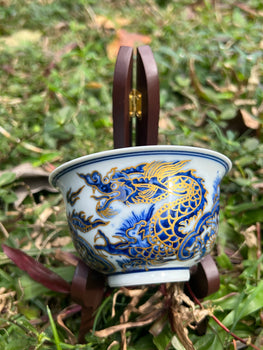 This is a Chinese Jingdezhen blue and white porcelain dragon teapot gaiwan