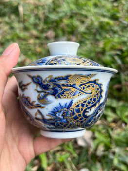 This is a Chinese Jingdezhen blue and white porcelain dragon teapot gaiwan