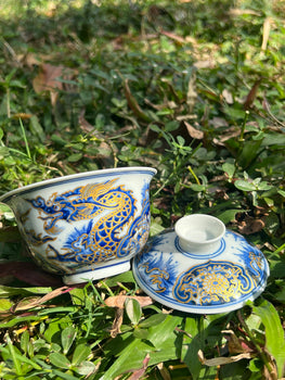 This is a Chinese Jingdezhen blue and white porcelain dragon teapot gaiwan