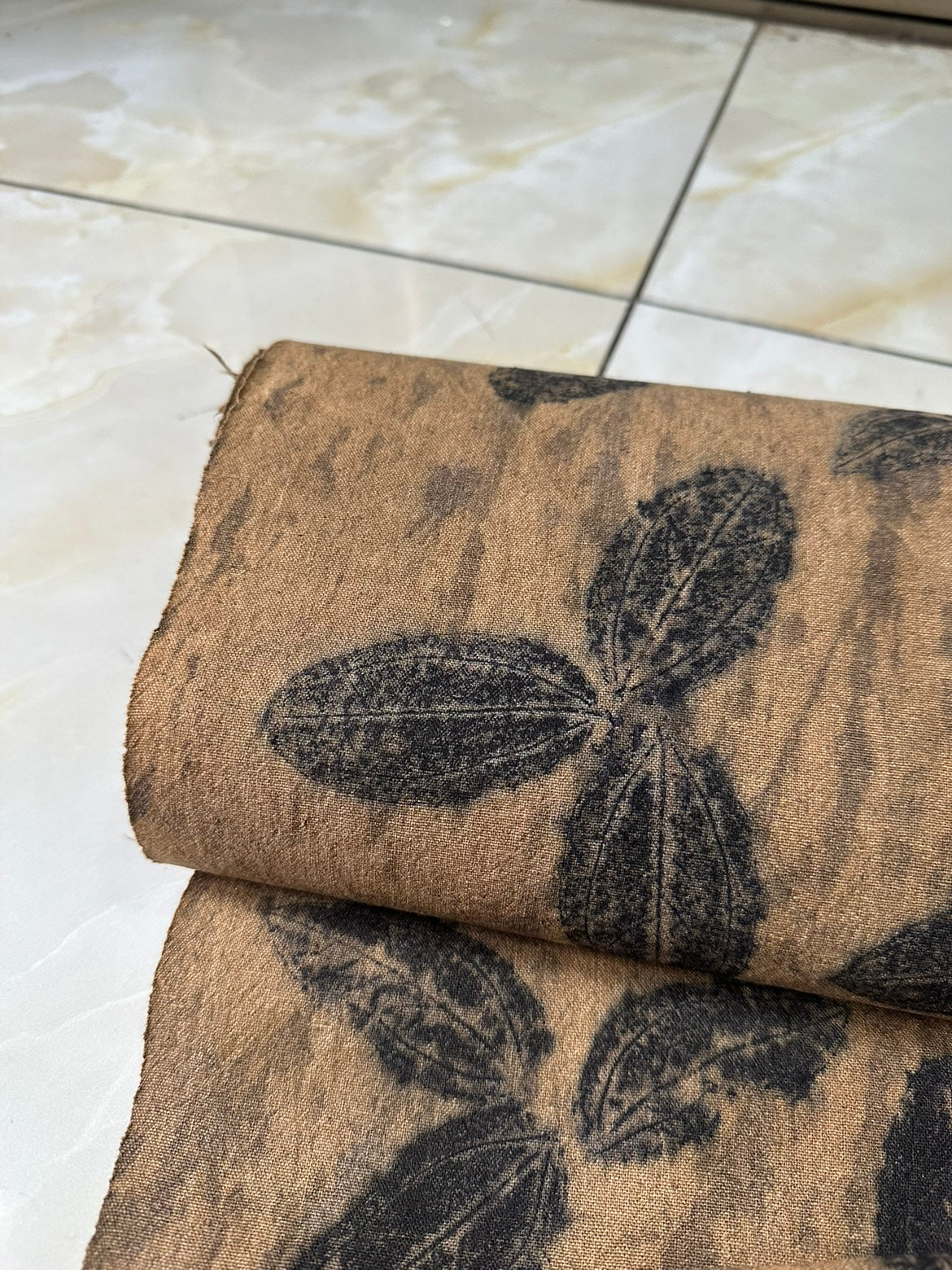 This is a plant-dyed tea mat table cloth