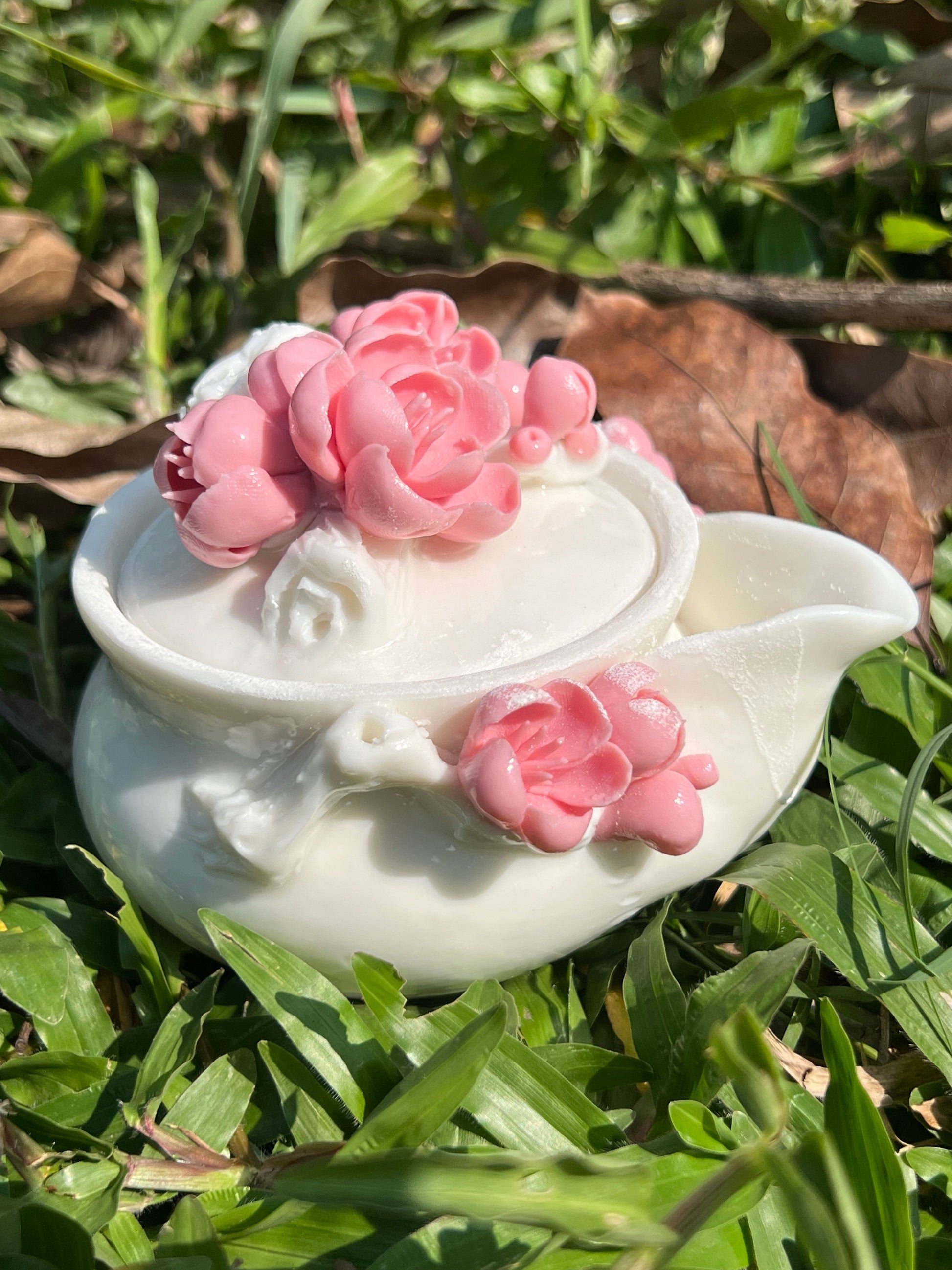 this is a woodfired white fine pottery flower teacup