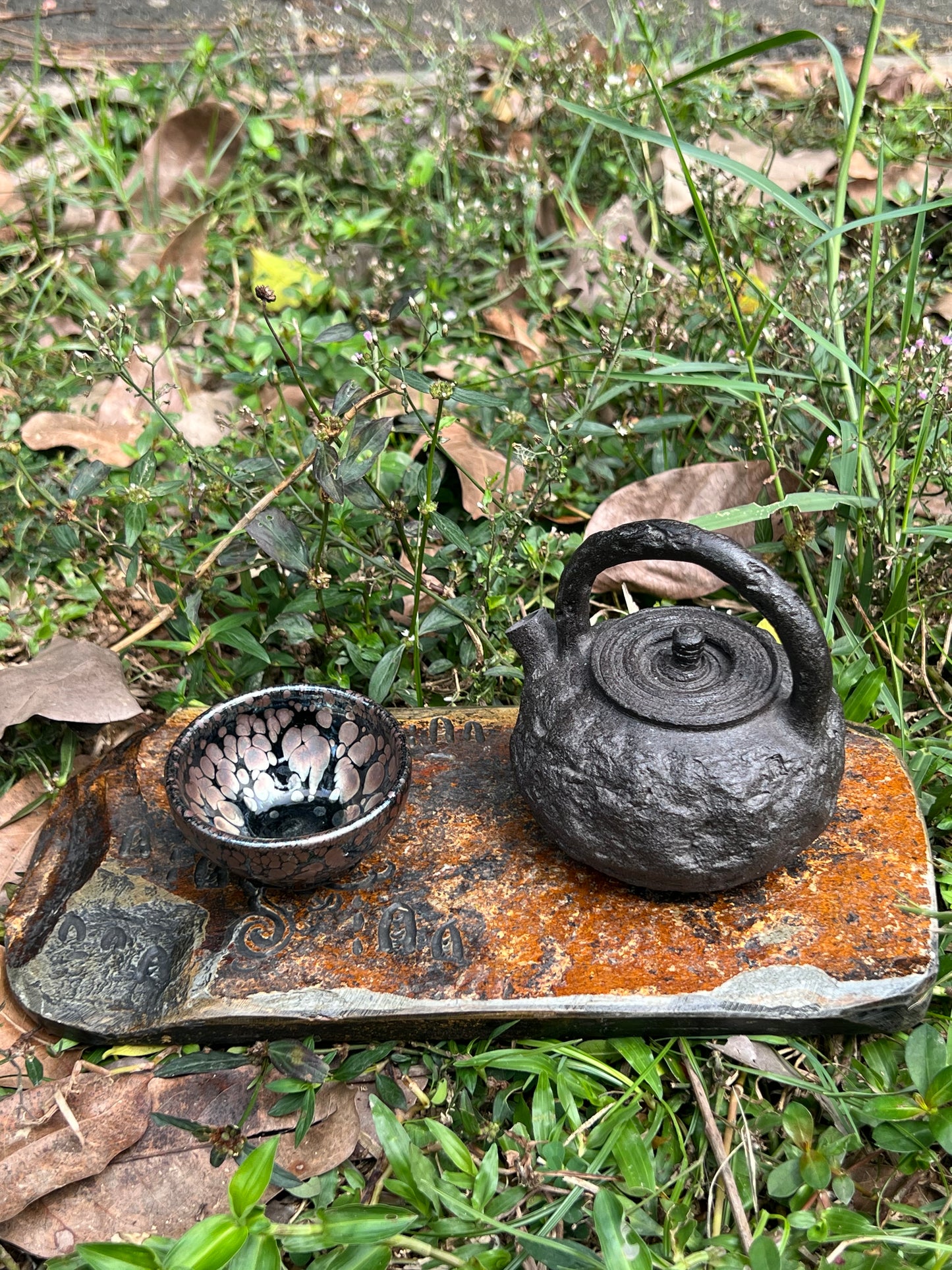 this is a purple clay teapot