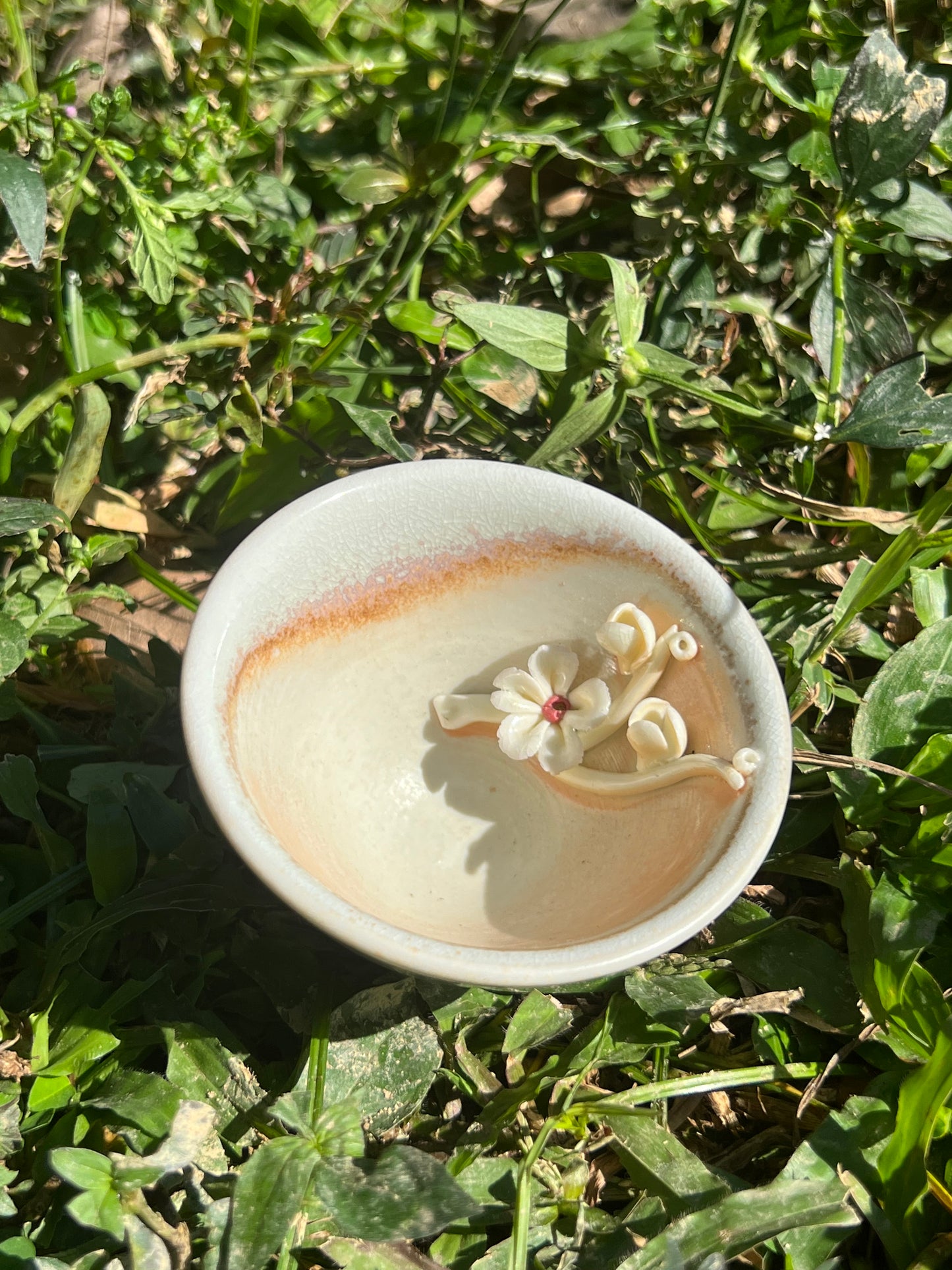 This is a woodfired pottery flower teacup