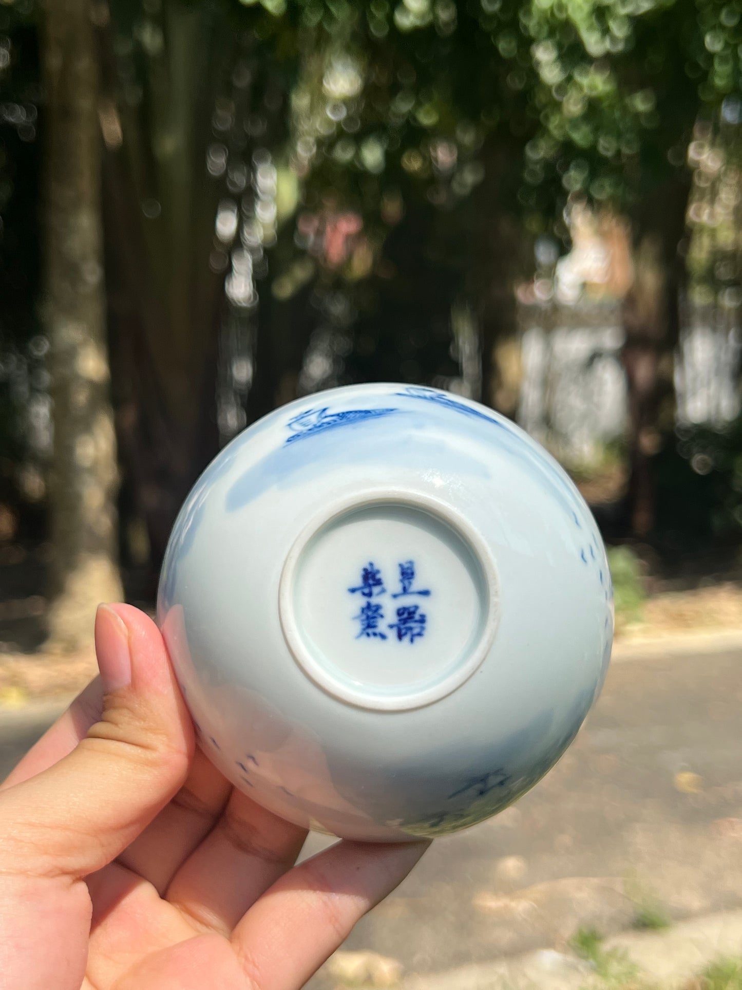 This is a Chinese Jingdezhen blue and white porcelain landscape teacup