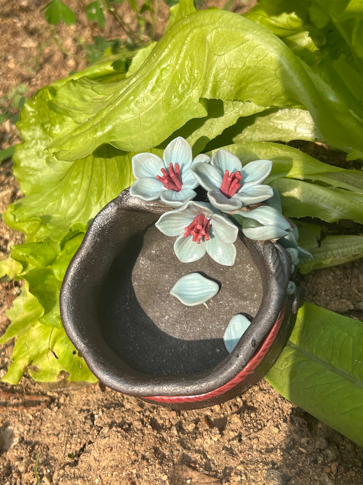 This is a woodfired tietai pottery flower teacup