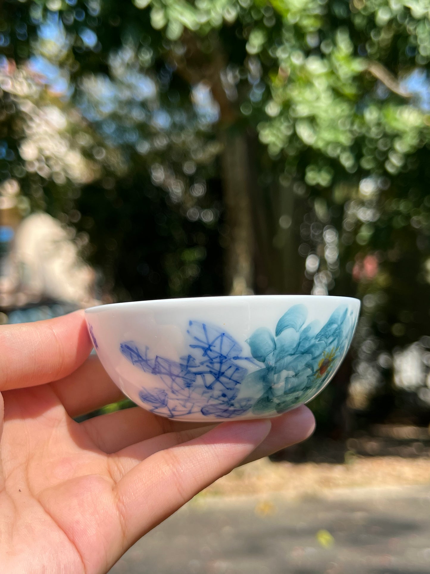 This is a Chinese Jingdezhen blue and white porcelain peony flower teacup