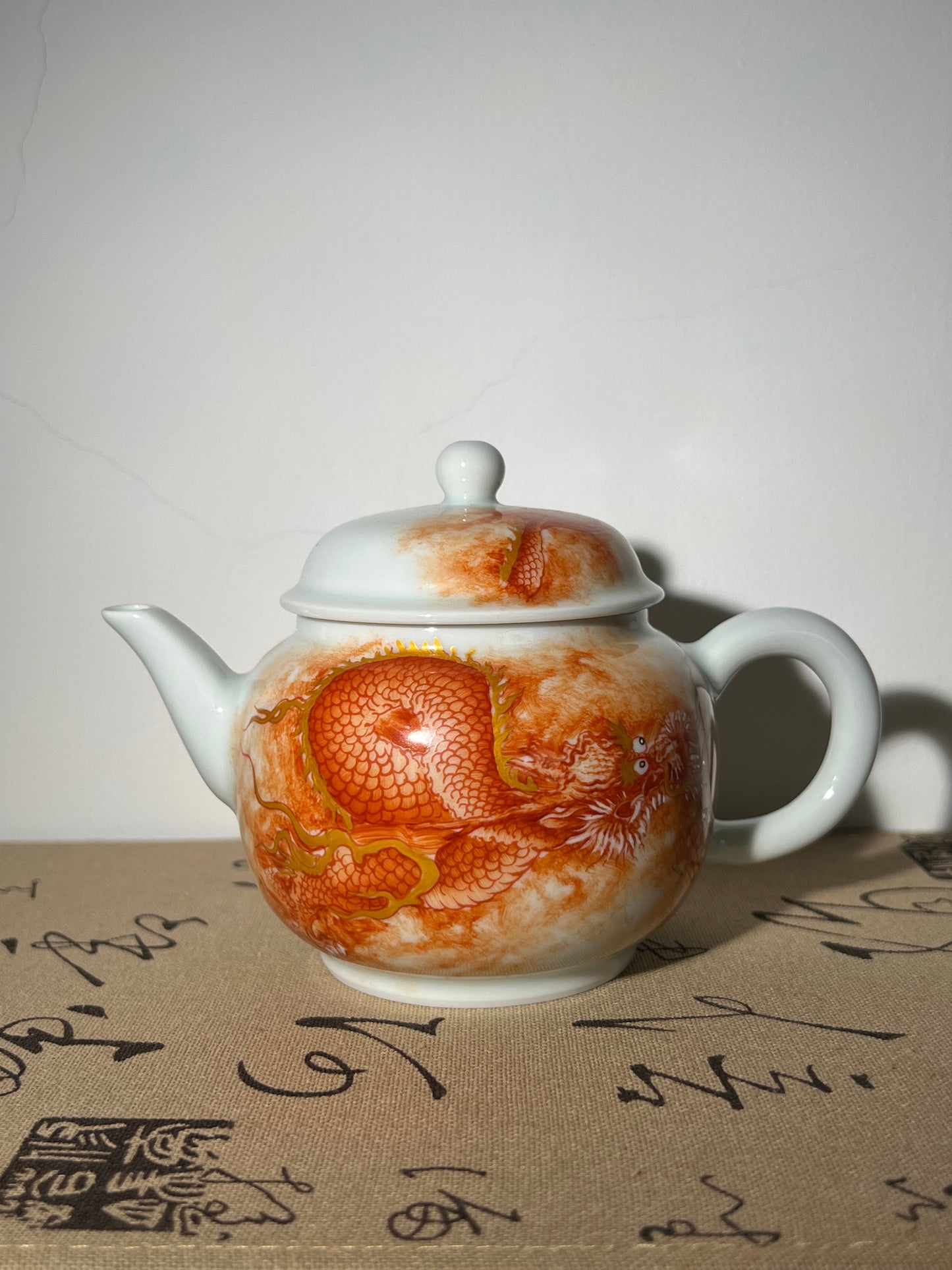 this is a Chinese Jingdezhen alum red dragon phoenix teapot.this is a ceramic teapot