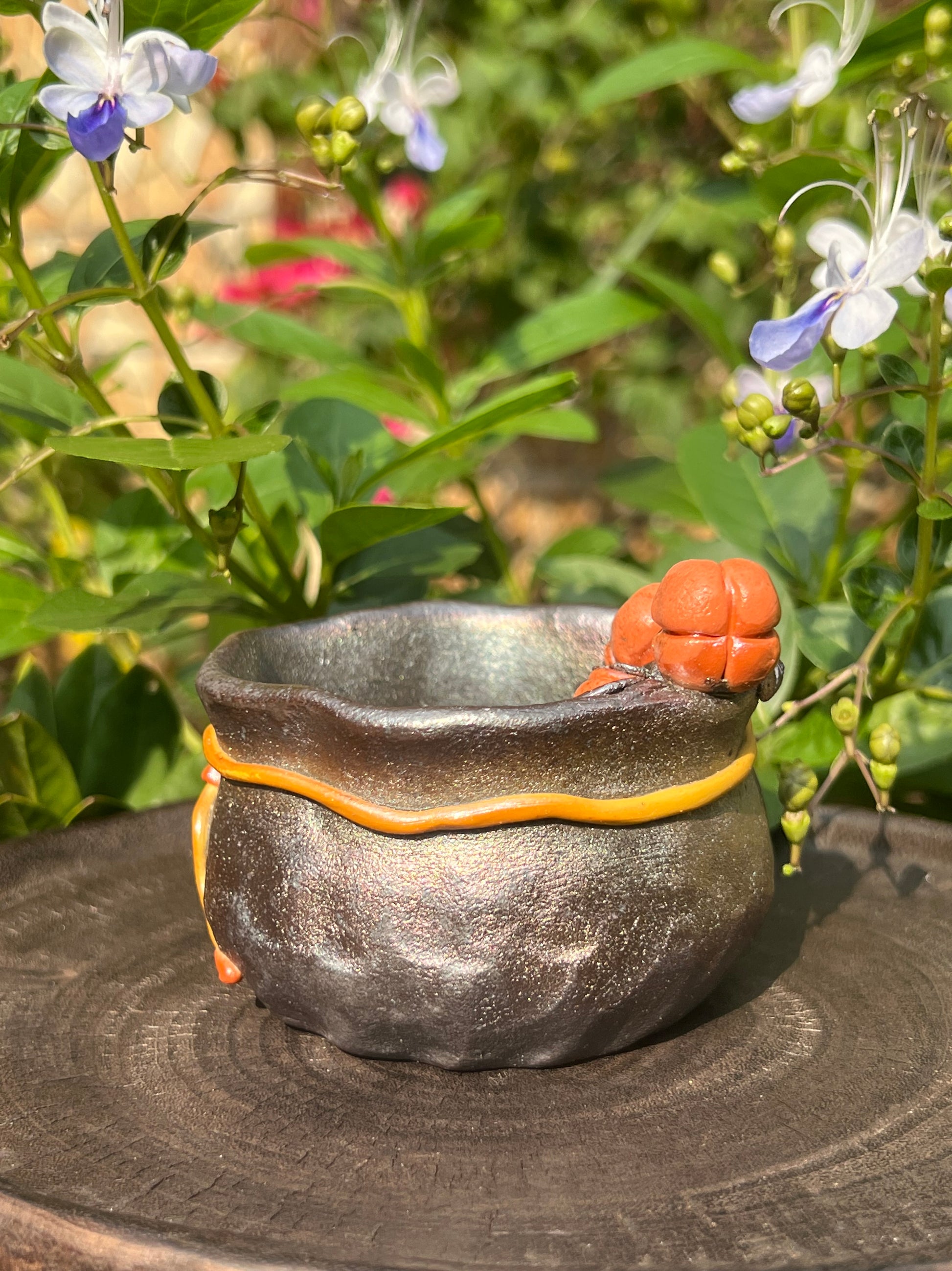 This is a woodfired tietai pottery flower teacup