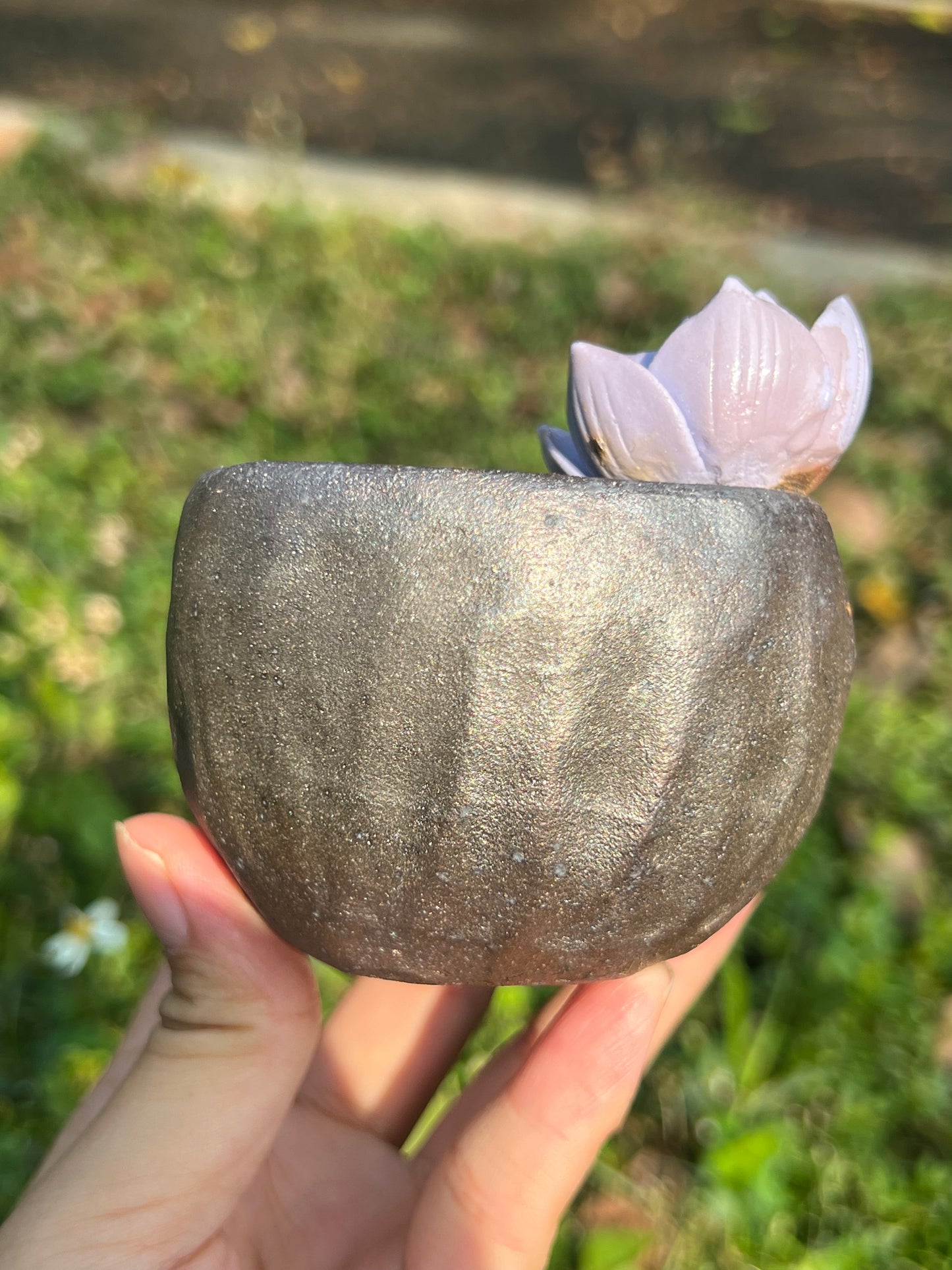 This is a woodfired tietai pottery flower teacup