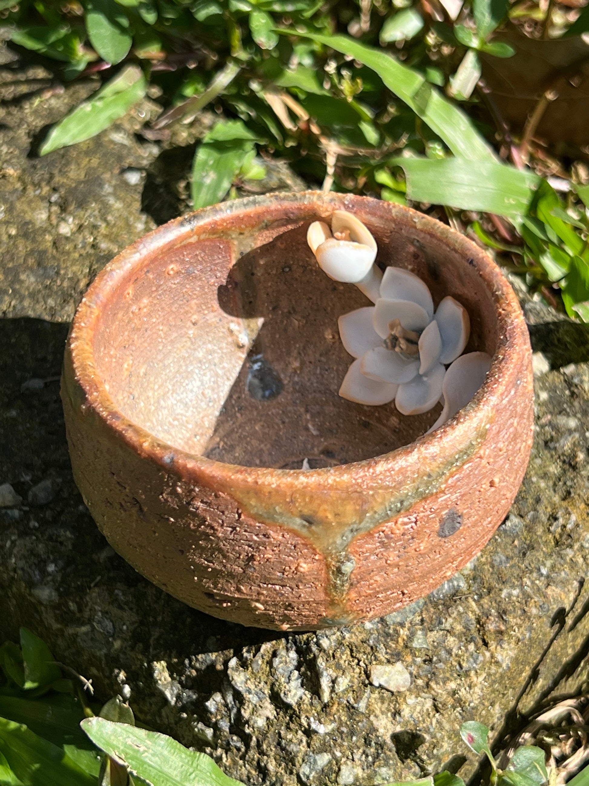 This is a woodfired pottery flower teacup