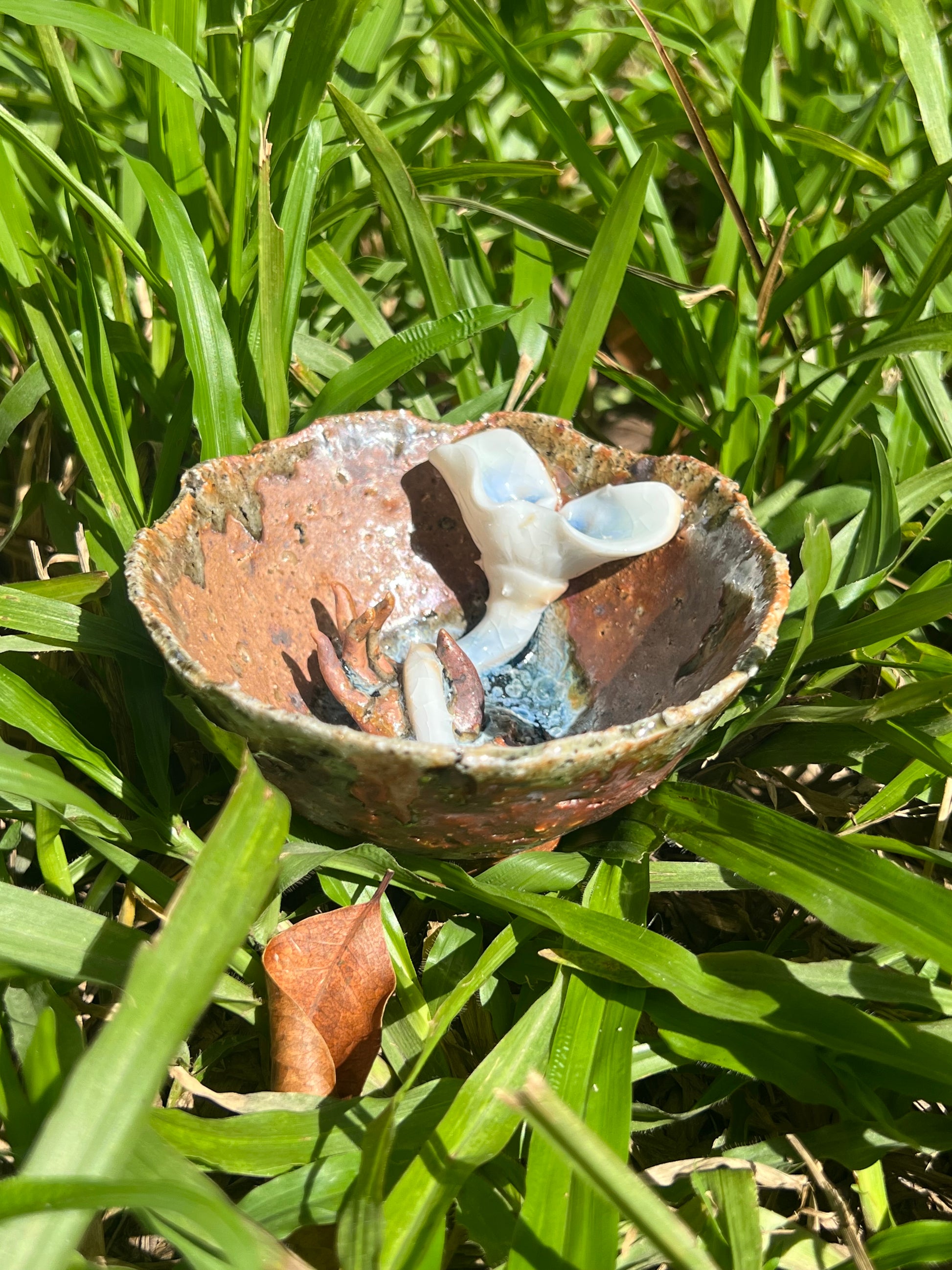 This is a woodfired pottery flower teacup