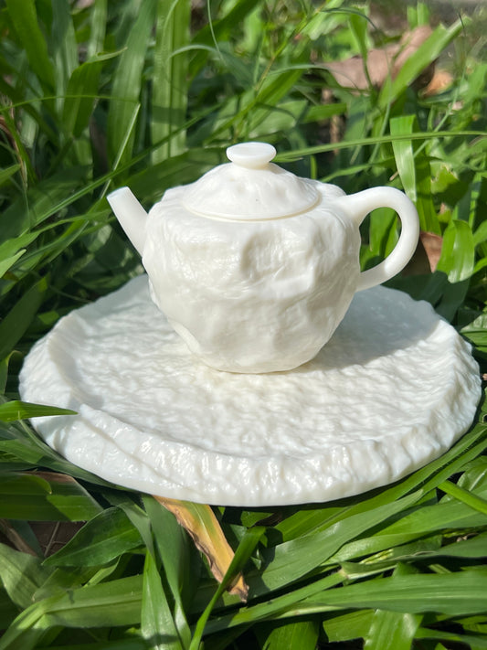 this is a white pottery teapot. this is Chinese mutton fat jade teapot