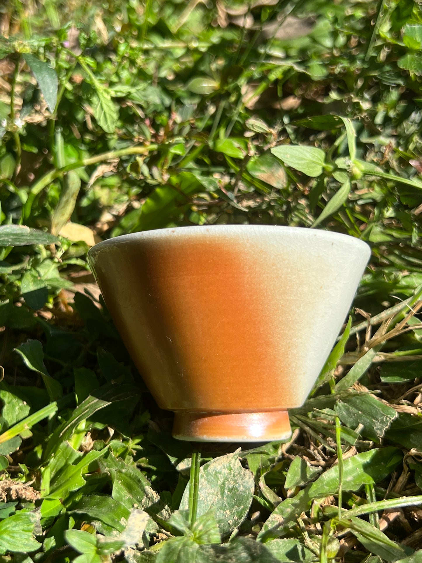 This is a woodfired pottery flower teacup