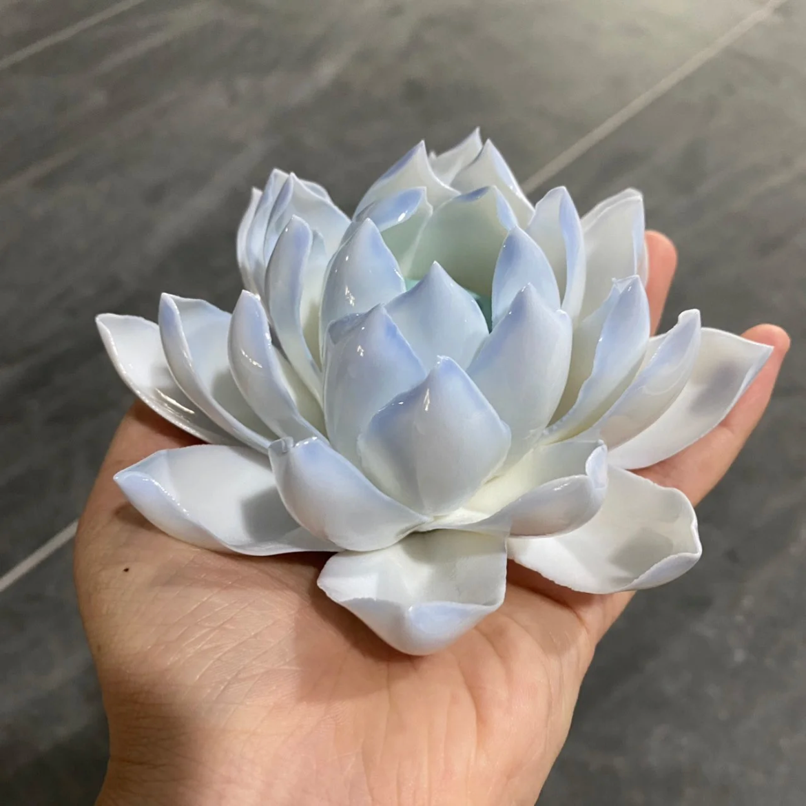 This is a ceramic lotus incense holder