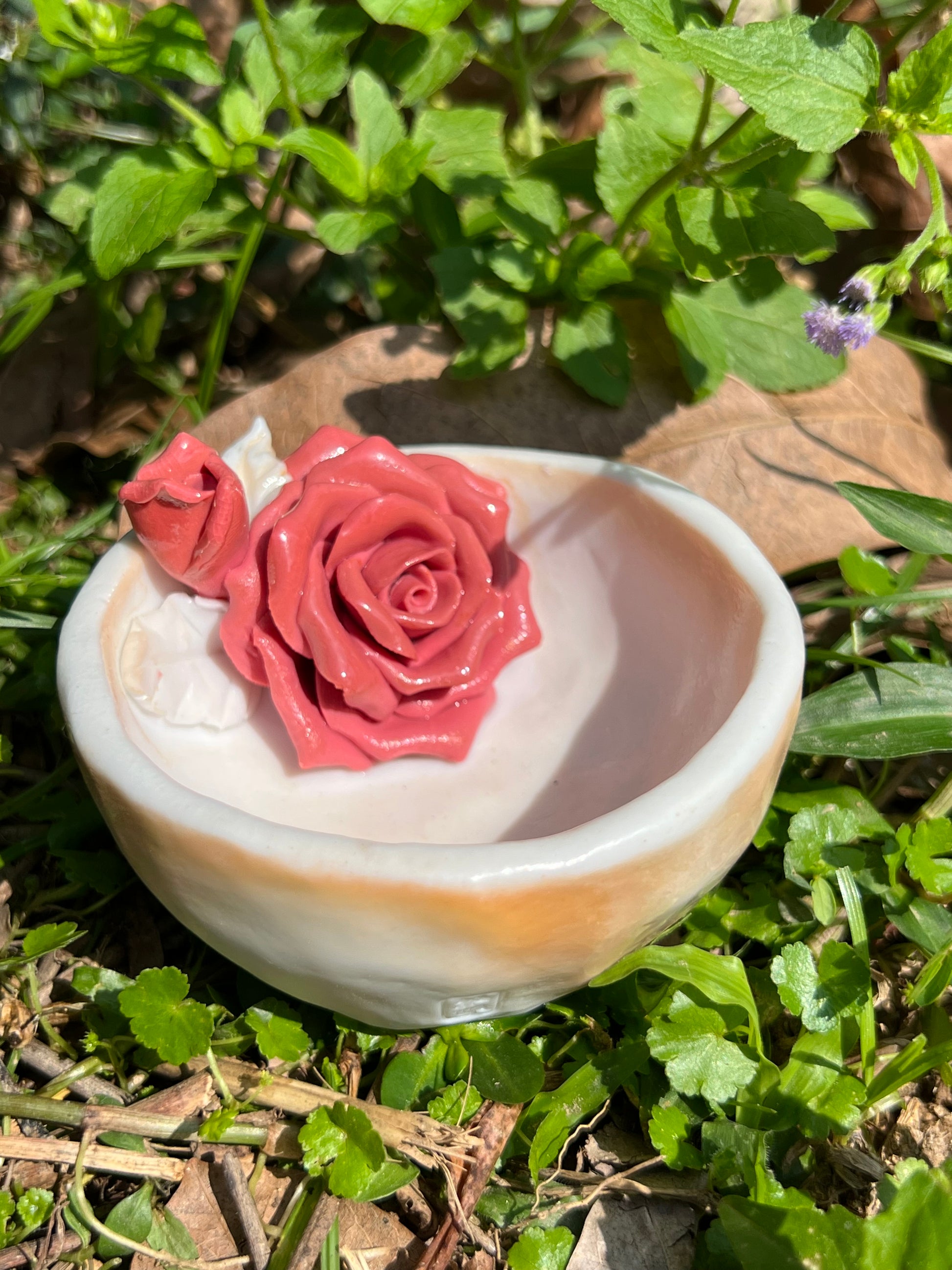 This is a woodfired pottery flower teacup