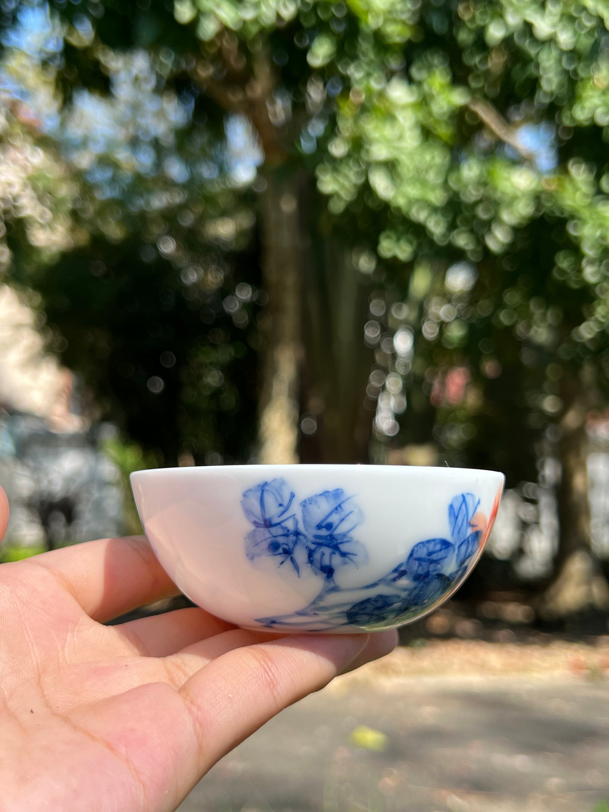 This is a Chinese Jingdezhen blue and white porcelain peony flower teacup