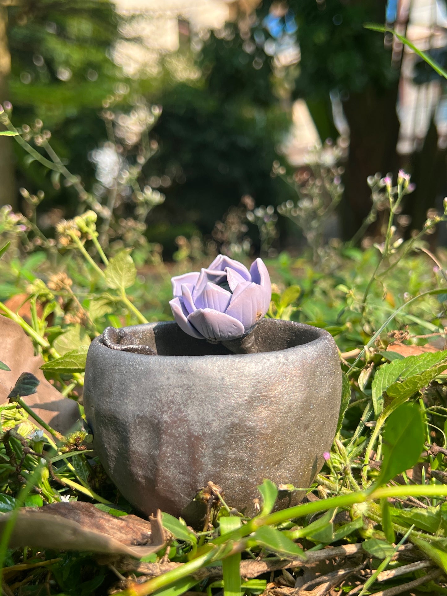 This is a woodfired tietai pottery flower teacup