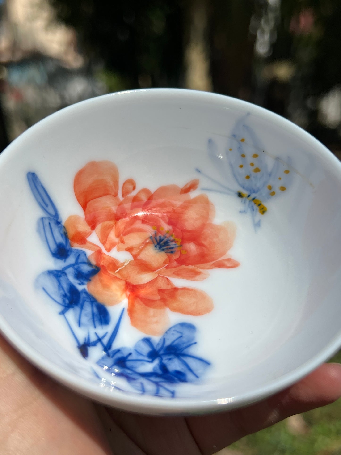 This is a Chinese Jingdezhen blue and white porcelain peony flower teacup