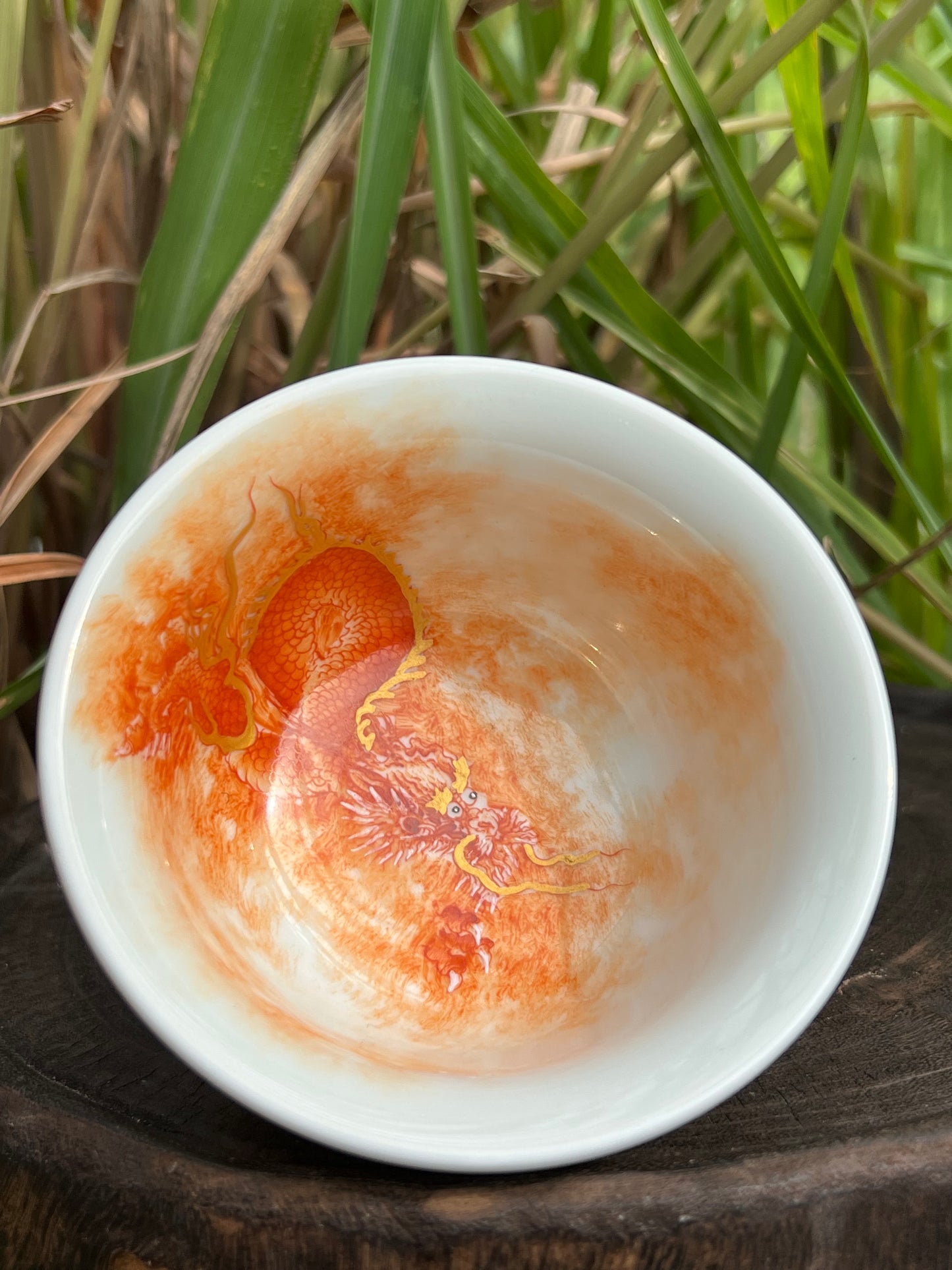 this is a Chinese Jingdezhen alum red dragon phoenix teacup. this is a ceramic teacup