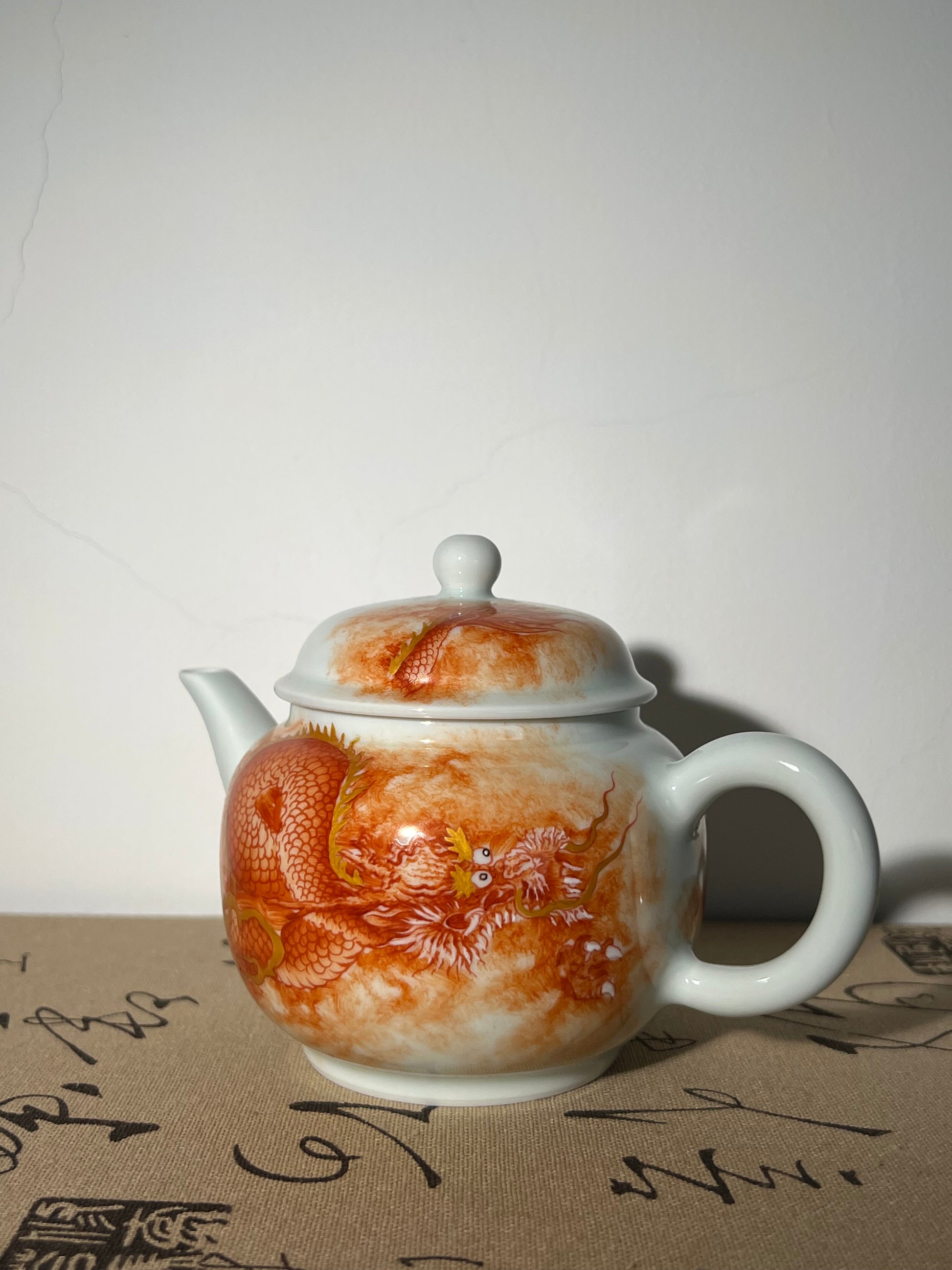 this is a Chinese Jingdezhen alum red dragon phoenix teapot.this is a ceramic teapot