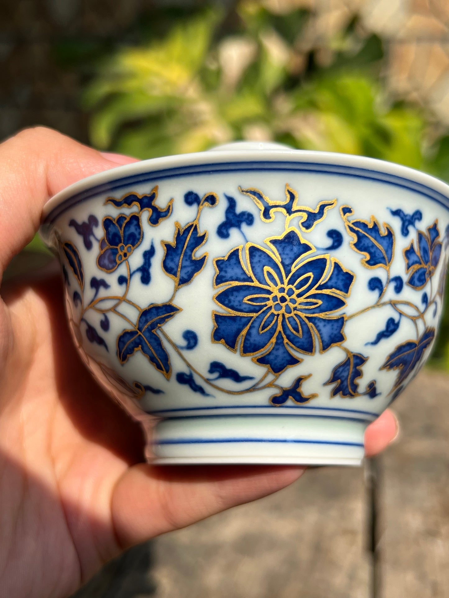 This is a Chinese Jingdezhen blue and white porcelain flower teapot gaiwan