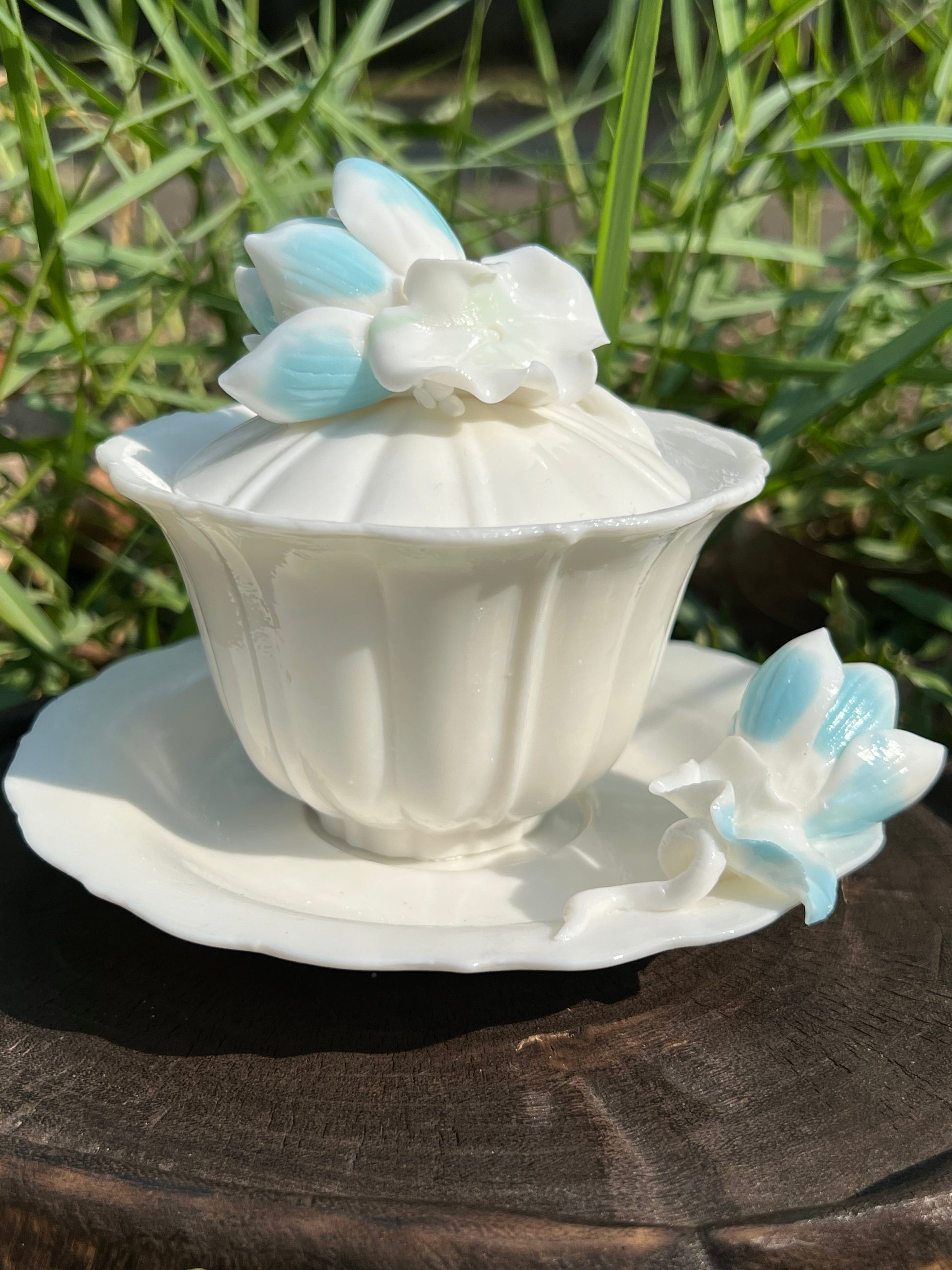 this is a woodfired white fine pottery flower teacup